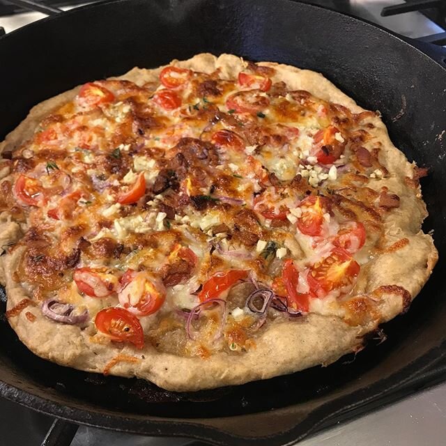 Delicious cast iron pan pizza made with @breadboard_bakery pizza dough! Super easy lunch, I didn&rsquo;t even make a sauce, just tossed in a few flavor bomb tomatoes.