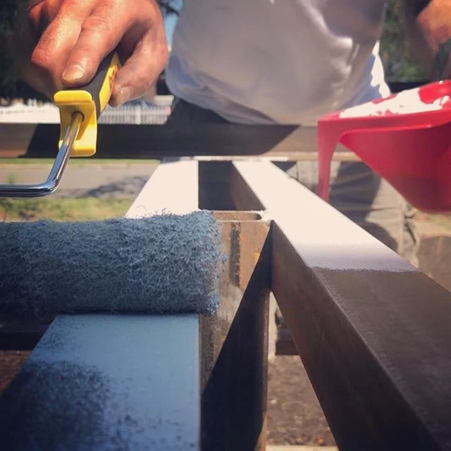 So much happened today at the garden! We sanded + primed the table frame, transplanted flowers along the path, watered the earth with our rain barrels, and flat out worked our tails off! We even installed sod yesterday to be launch ready in just a fe