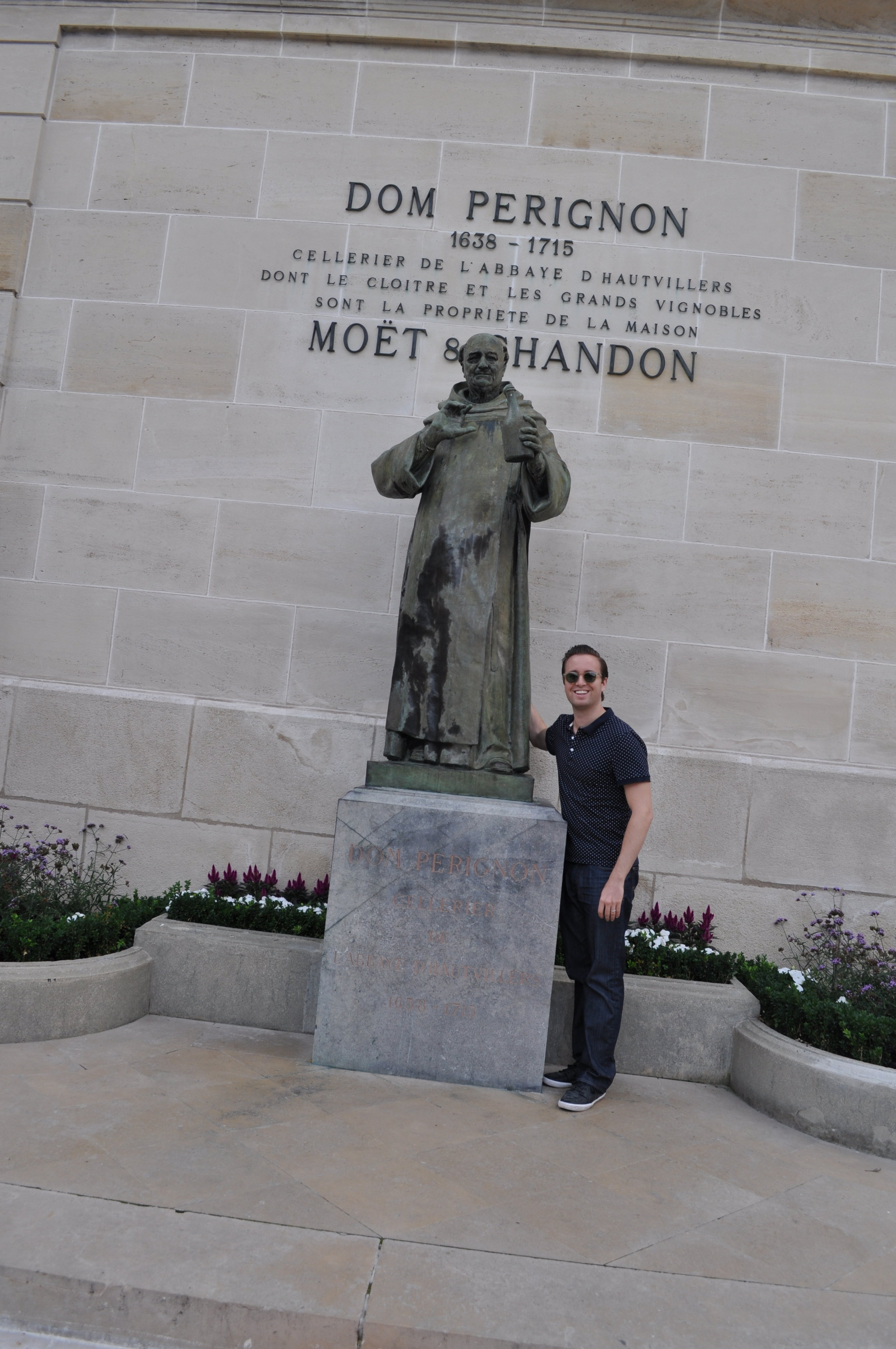 Nathan with Dom Pérignon statue at Moët &amp; Chandon