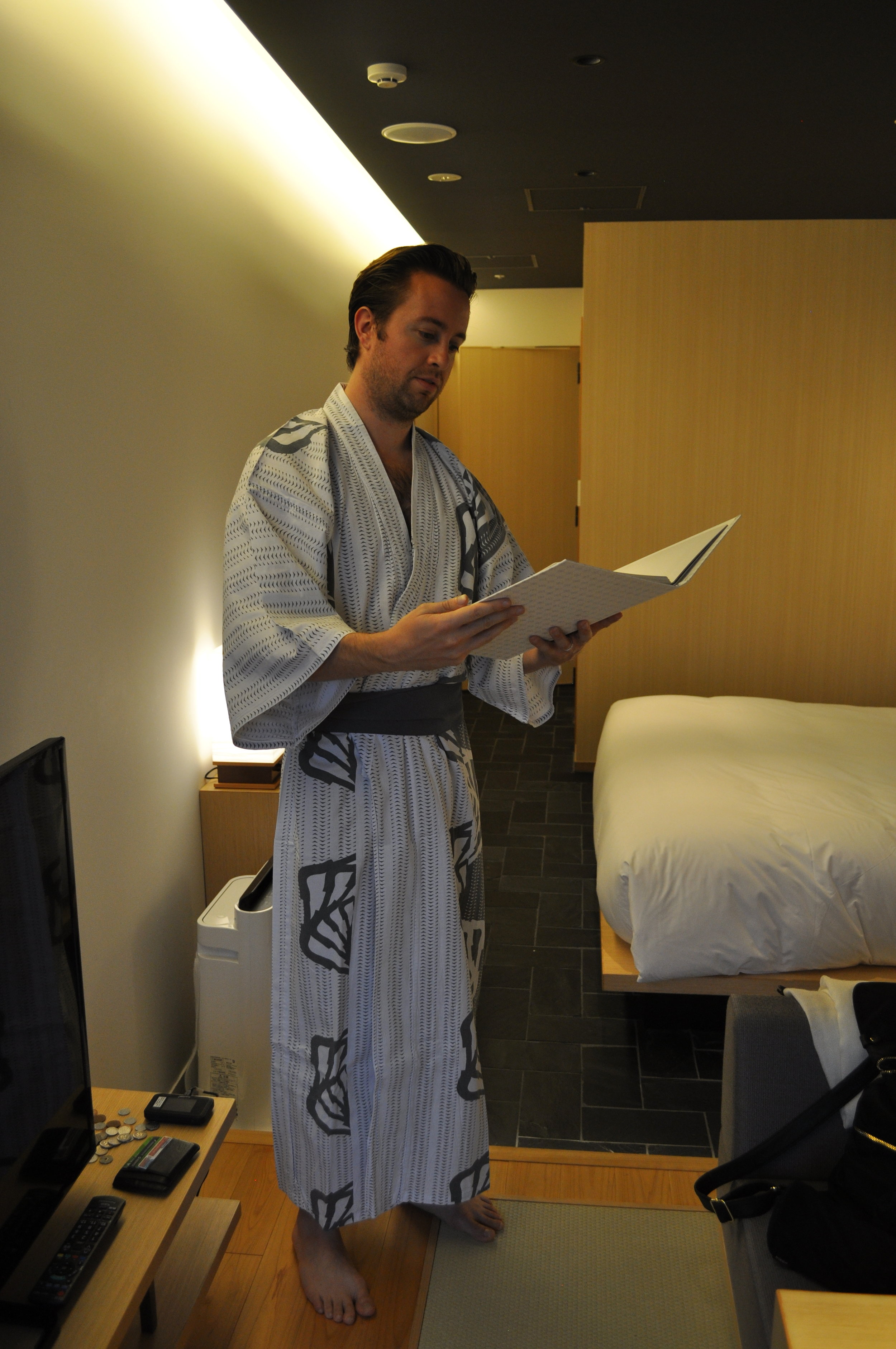 Pondering room service in a yukata