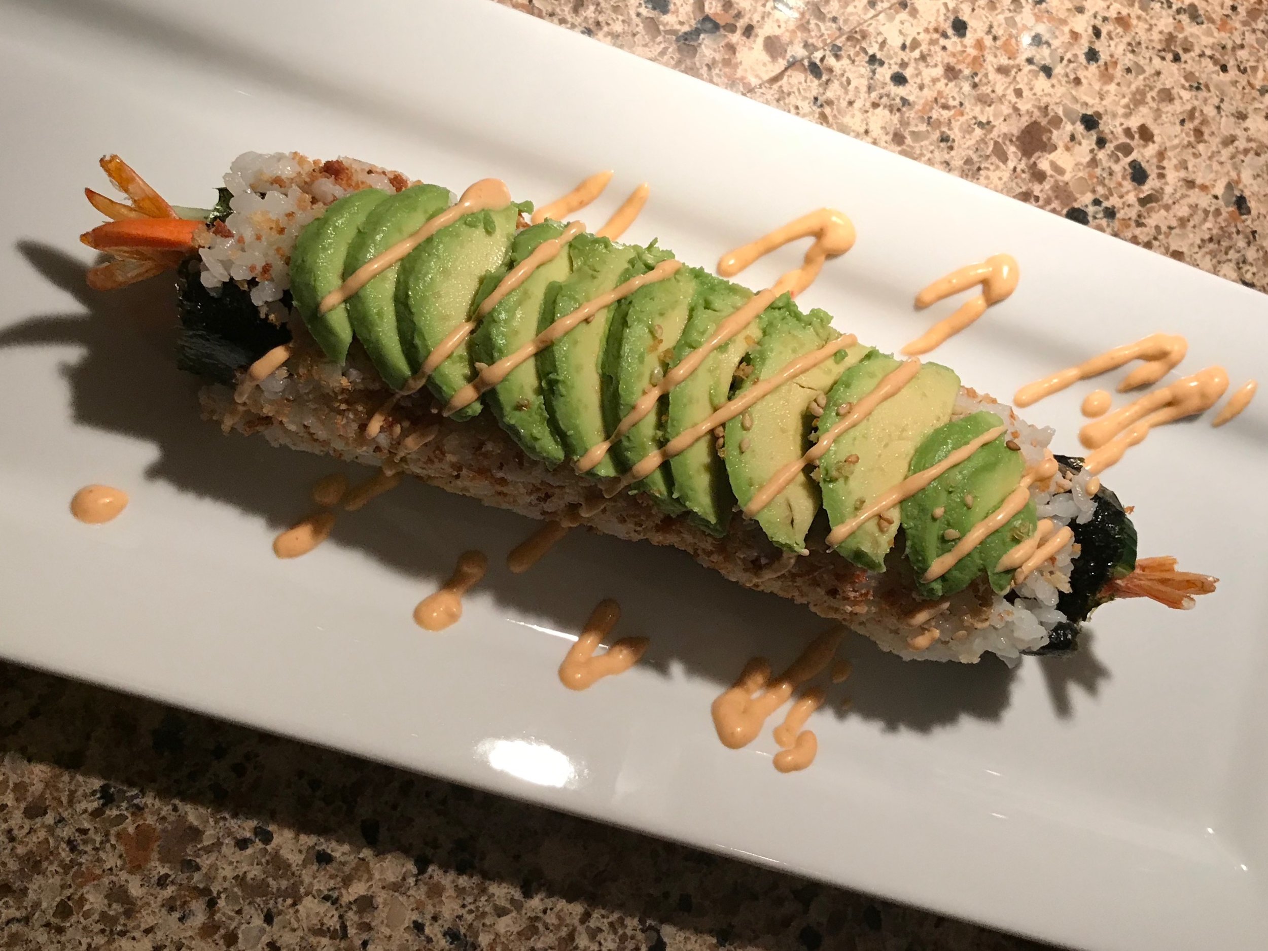 Dragon roll: shrimp, cucumber, avocado with sriracha mayo