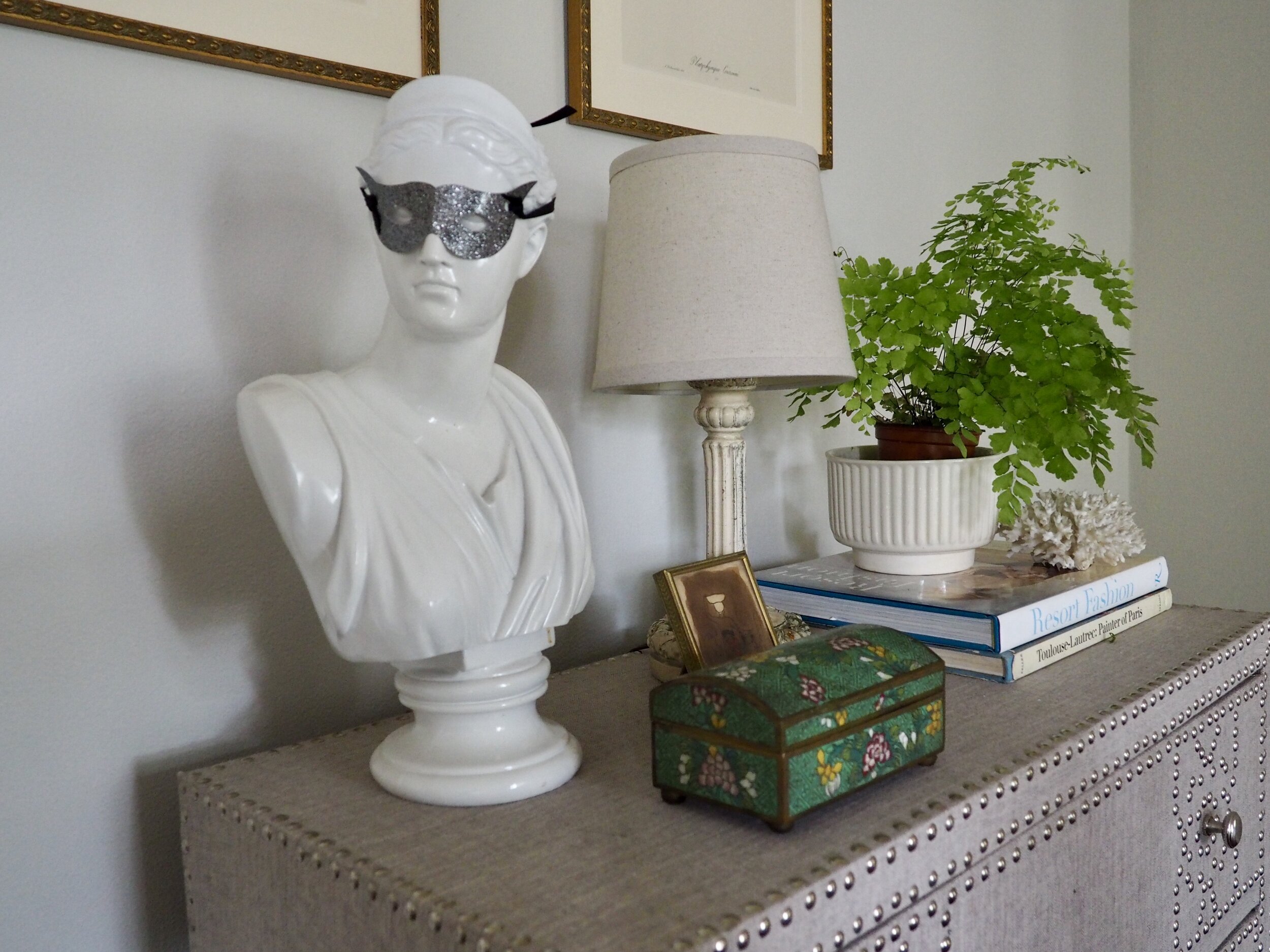 A masked lady presides over the living room