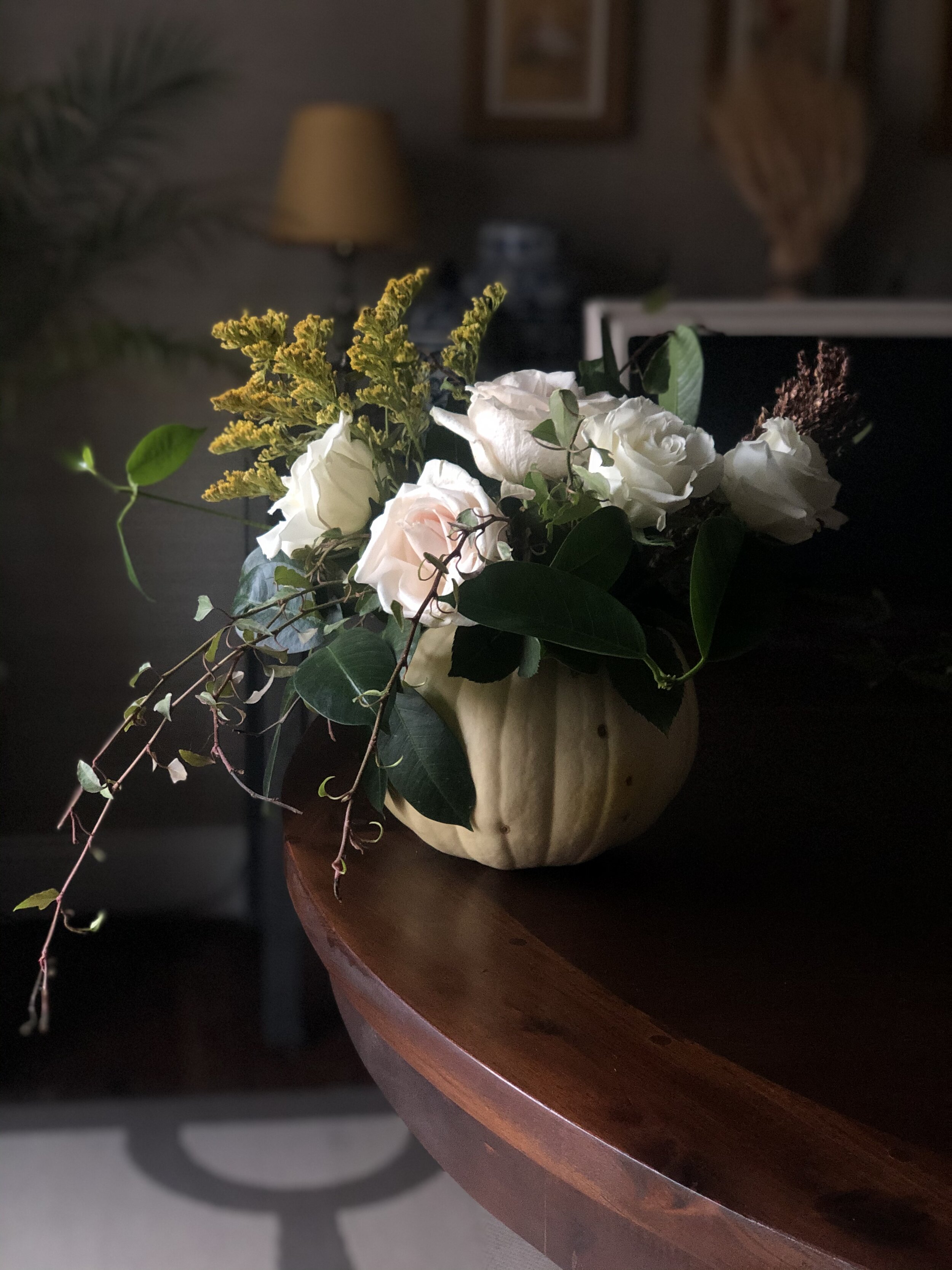 A white pumpkin floral arrangement