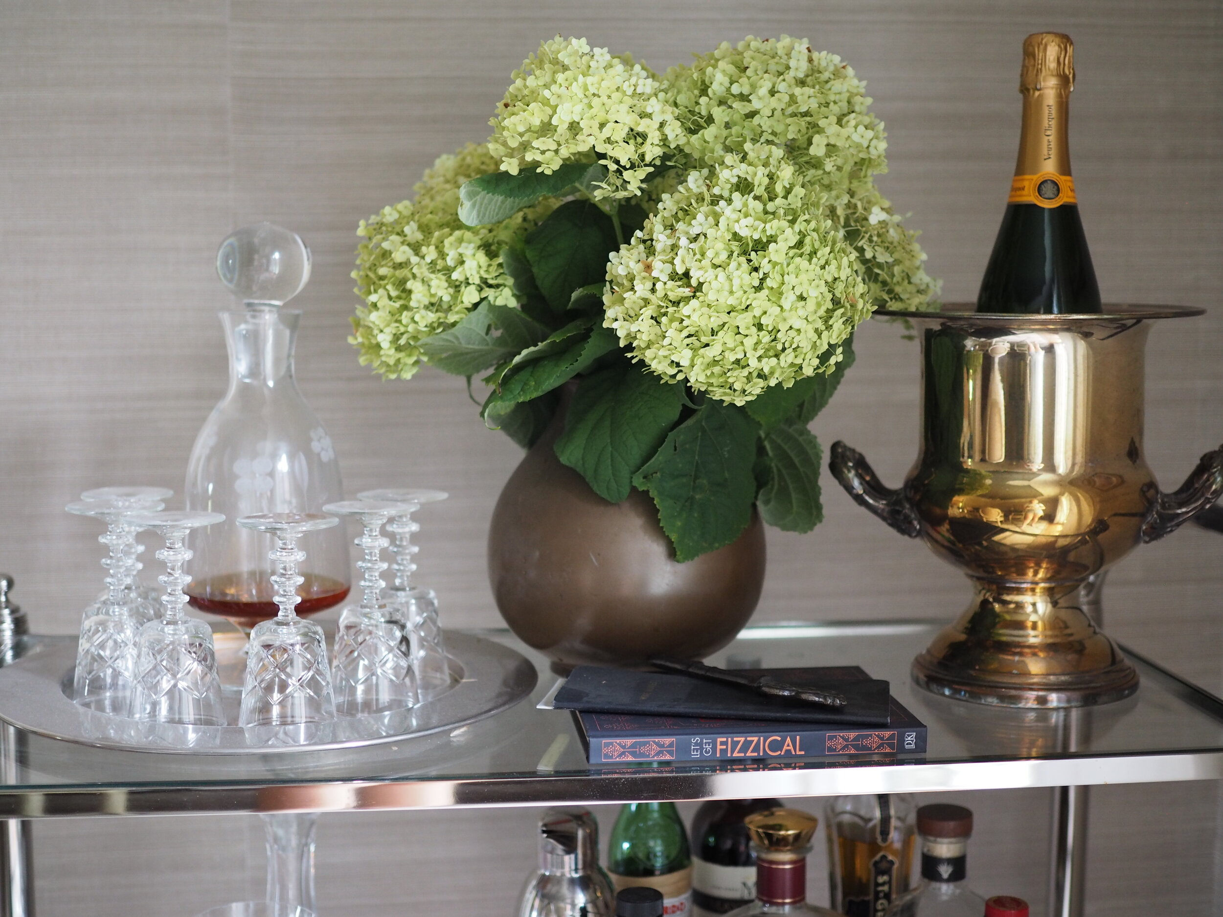 Port glasses, fresh hydrangeas and a vintage silver plated Champagne bucket