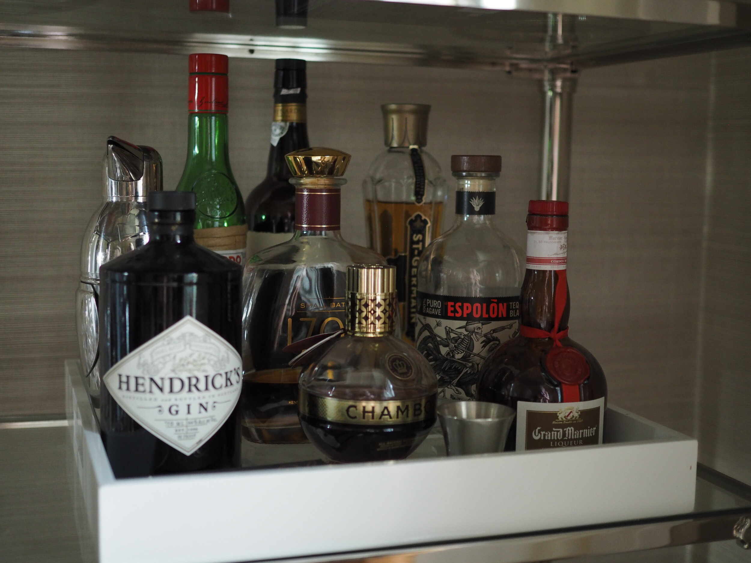 The bar essentials; we also keep Tito’s vodka and a couple of other items on hand, but those larger bottles are stored in a cabinet in the kitchen