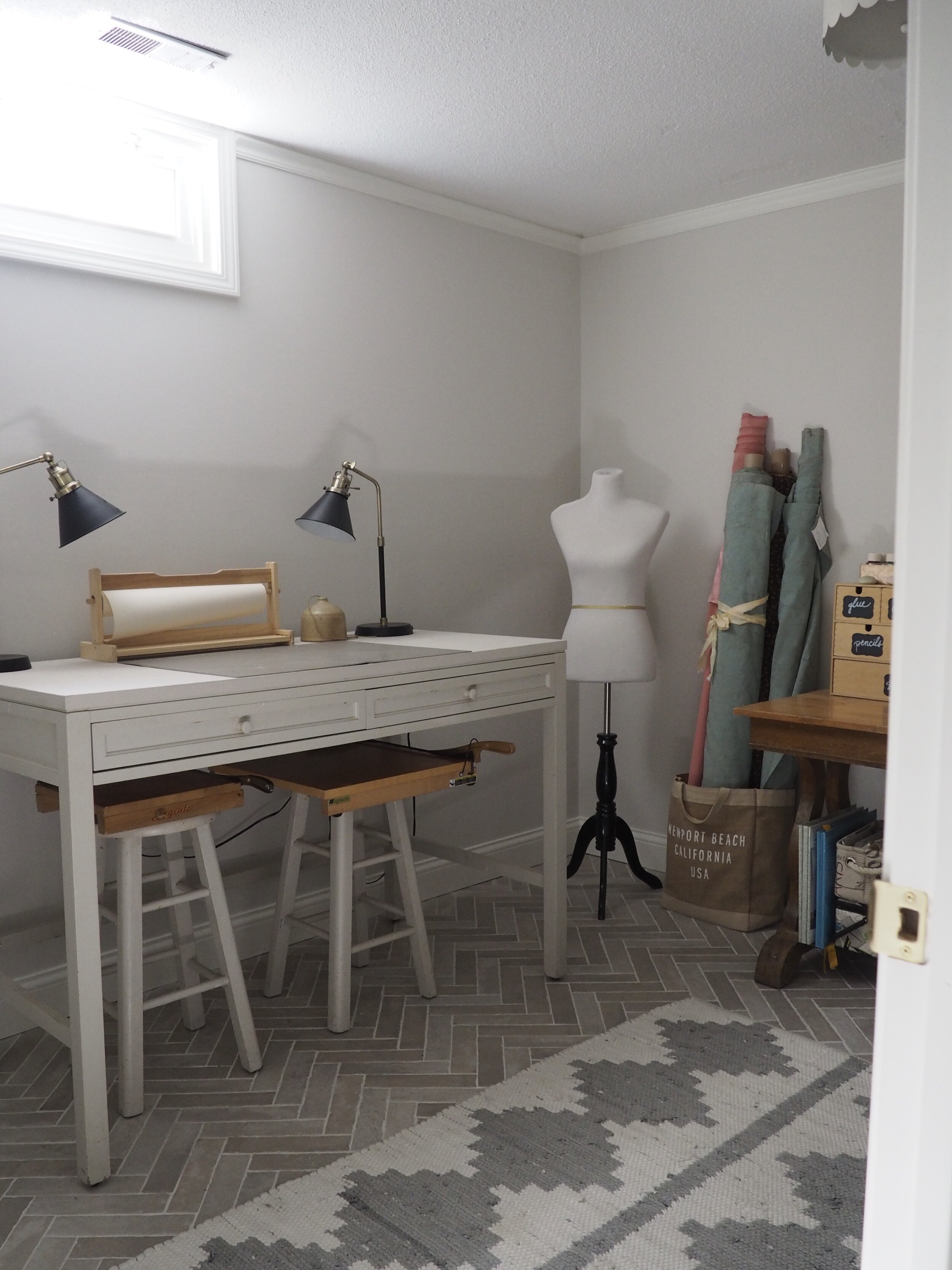 It’s so important to have a big work surface in a craft room. This one is the right height for standing with optional counter stools for a seated project. My vintage paper cutters rest on the stools when not in use.