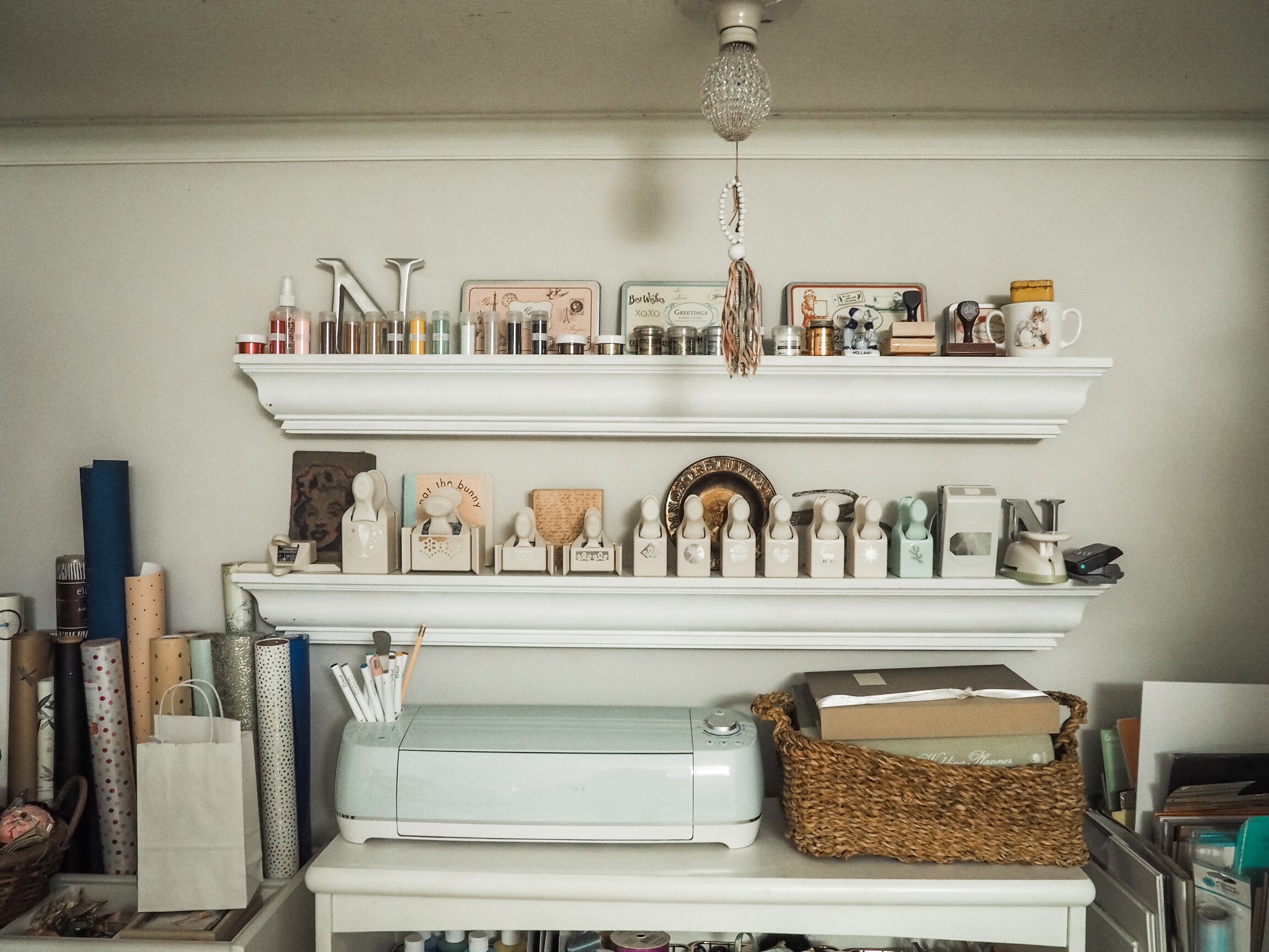 Photo shelves serve as display and open storage for embossing powders, stamps and decorative punches.
