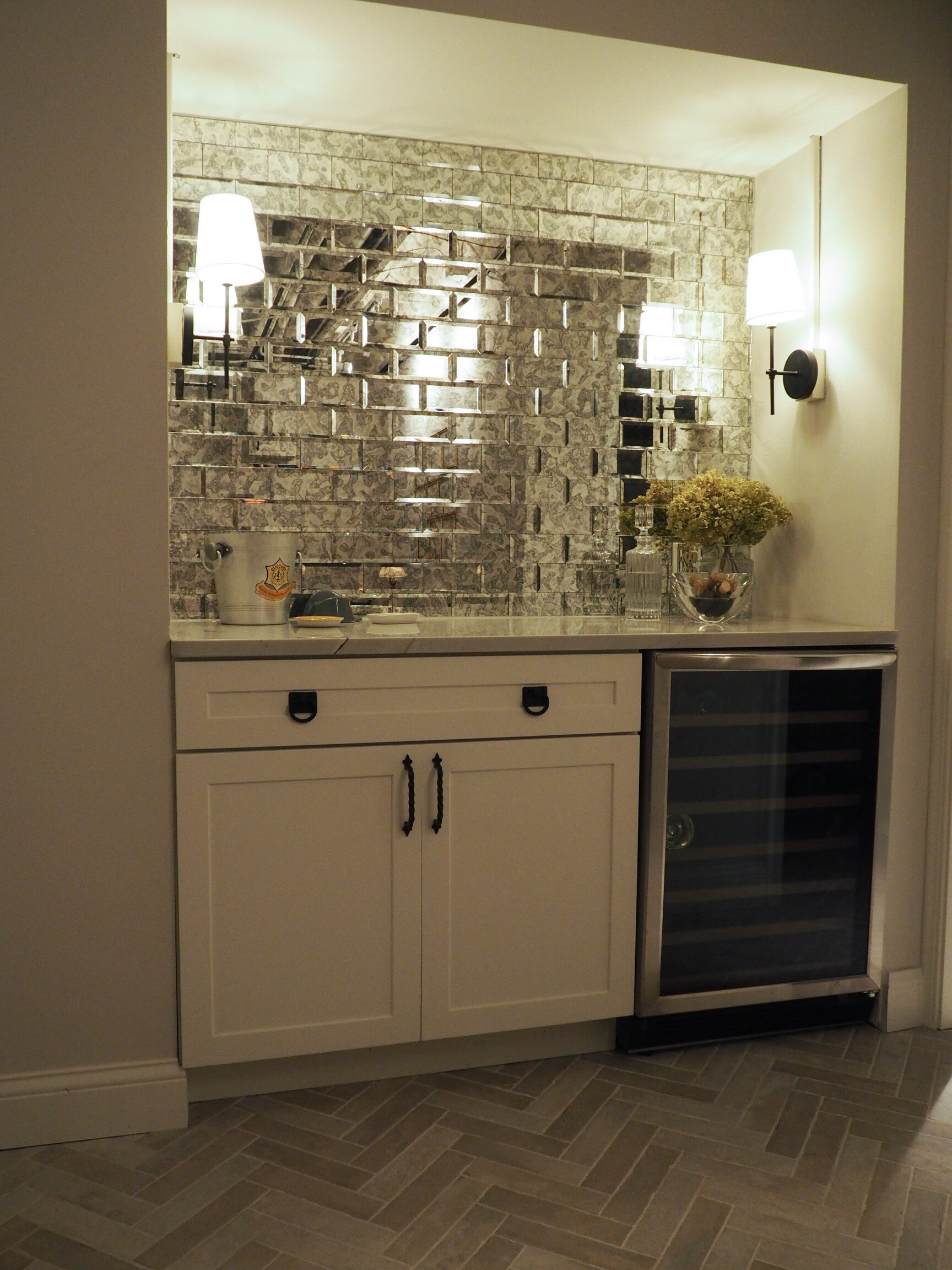Our dry bar and wine fridge; the antique mirrored subway tile adds some depth and sparkle
