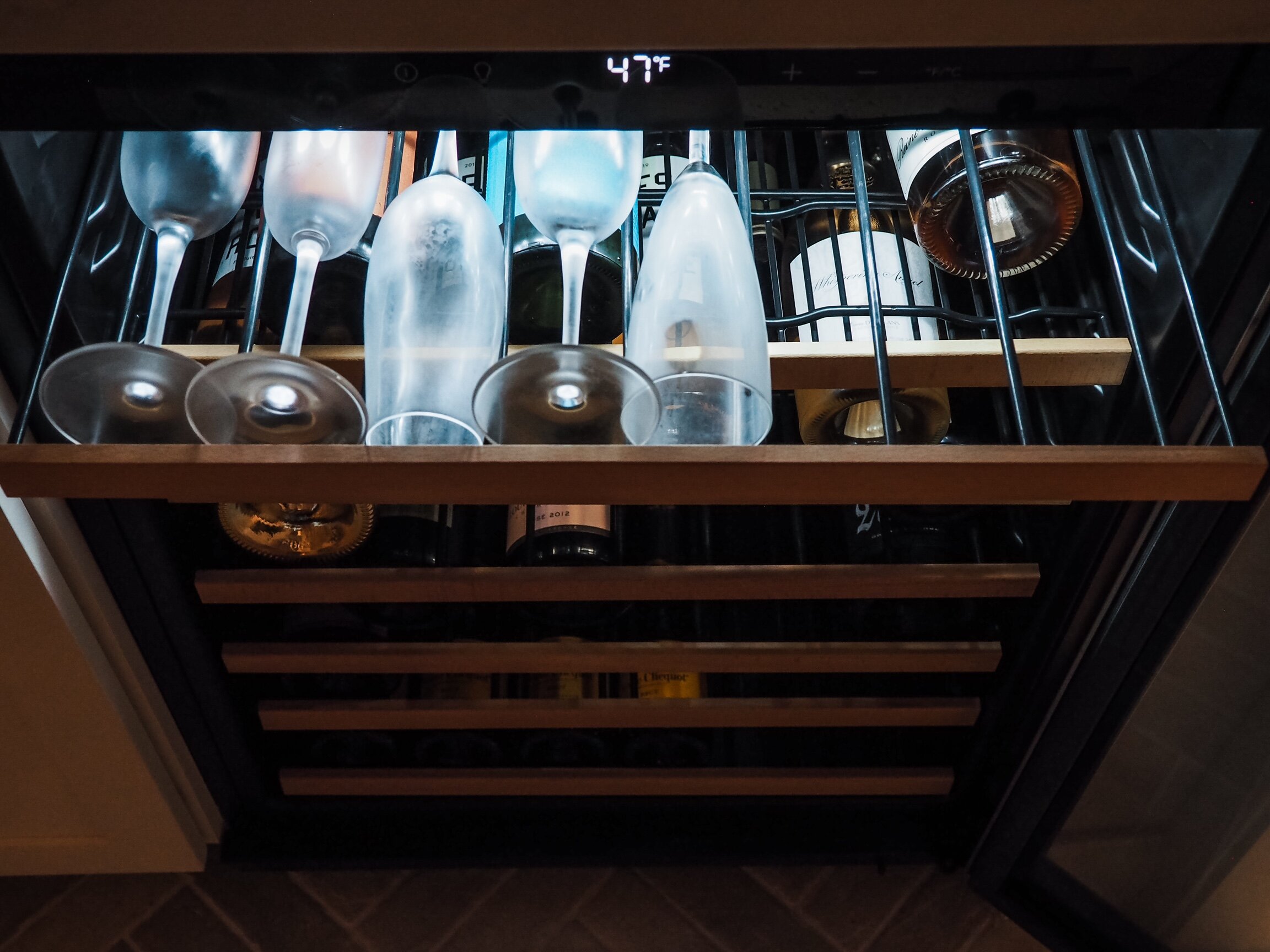 While we make an exception for a few white and rosé wines, this is primarily a Champagne refrigerator kept at an optimal 47°F. I keep Champagne flutes in the top shelf of the fridge so we can always enjoy a chilled glass.