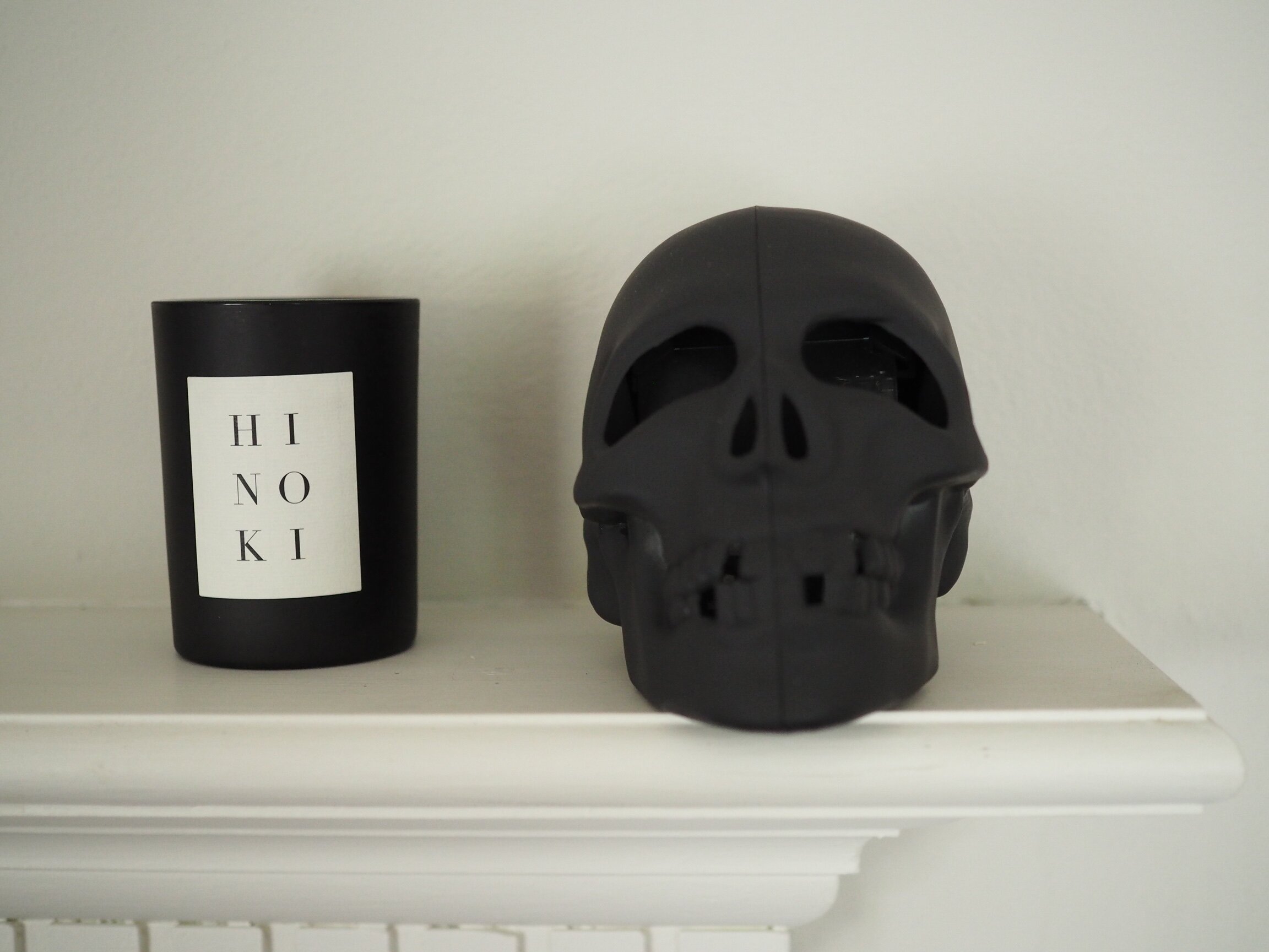 A menacing skull and candle on our mantle