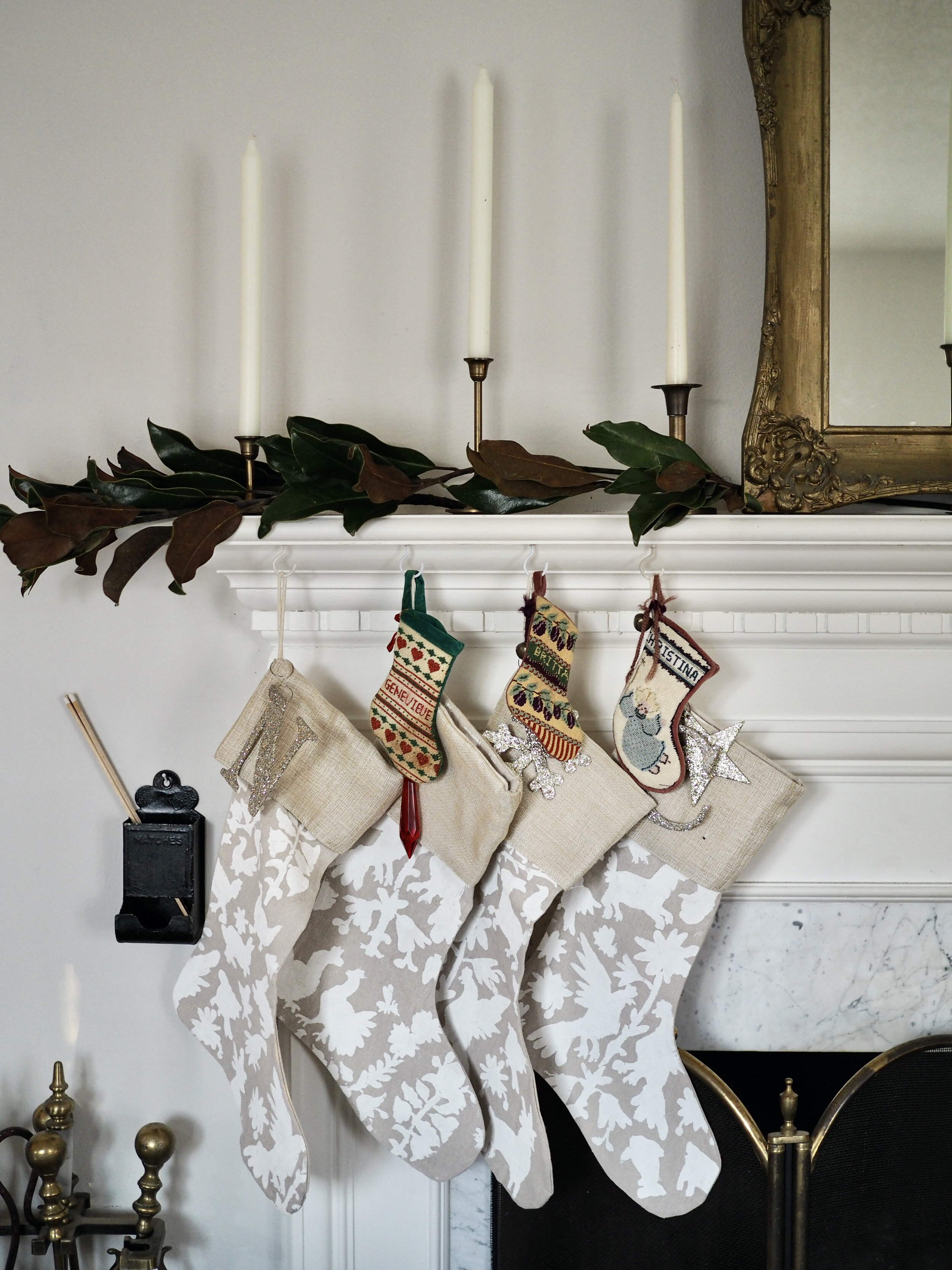 My sisters are here to celebrate with us this year, and we each added our needlepoint baby stockings to the mantle for Santa to fill; DIY for the canvas Otomi stockings here