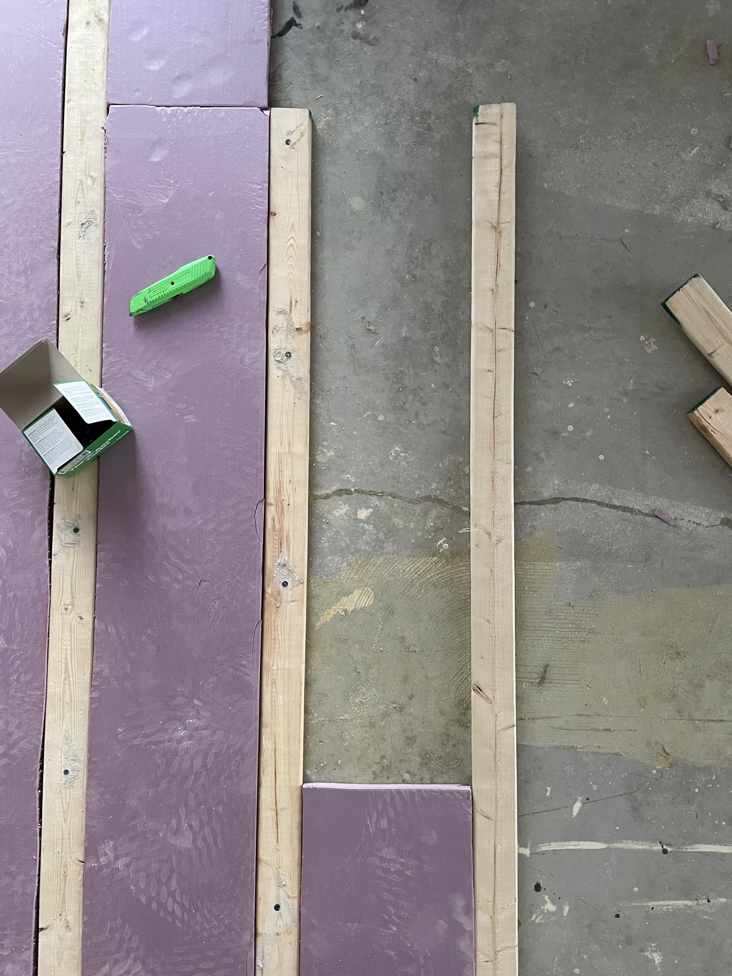 In order to install hardwood over the concrete slab in the guest, our installers built a ‘sleeper system’ with wood boards and insulation