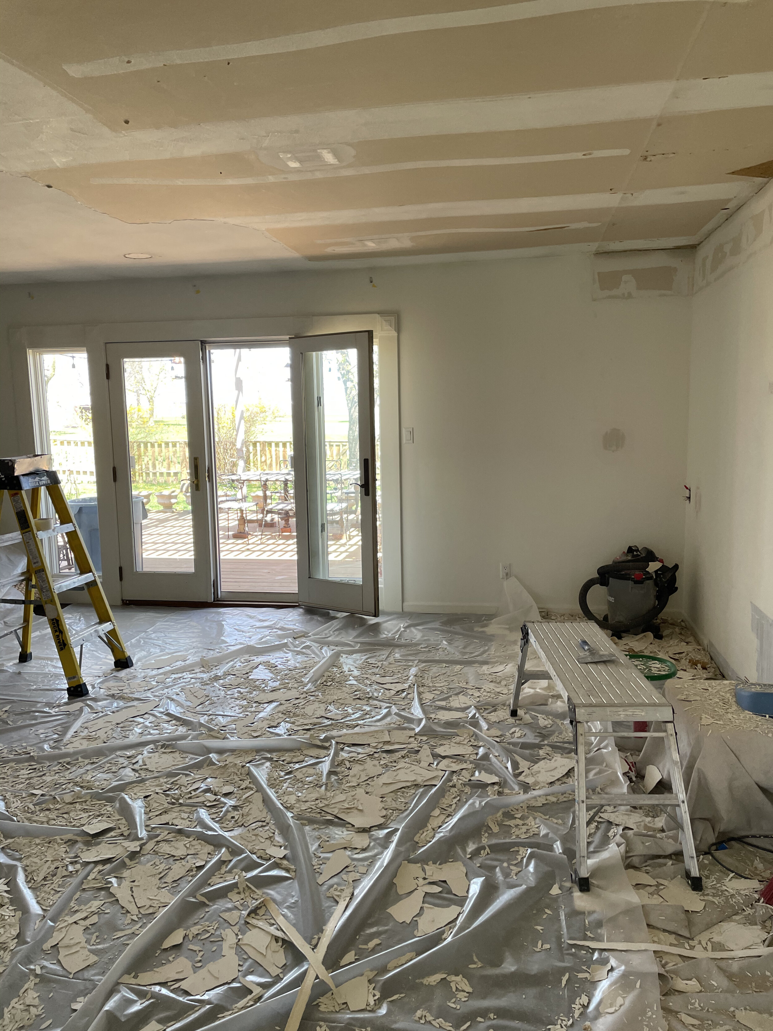 Mid-project, we learned the ceiling was skimcoated smooth over an old popcorn ceiling, so that meant a lot of scraping to get down to the drywall