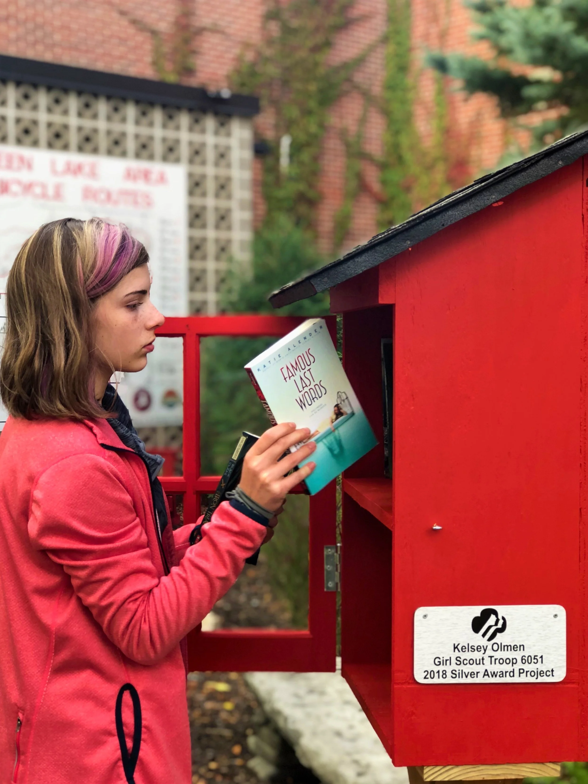 Green Lake’s Kelsey Olmen Installs Little Free Library on Town Square Bike Garden