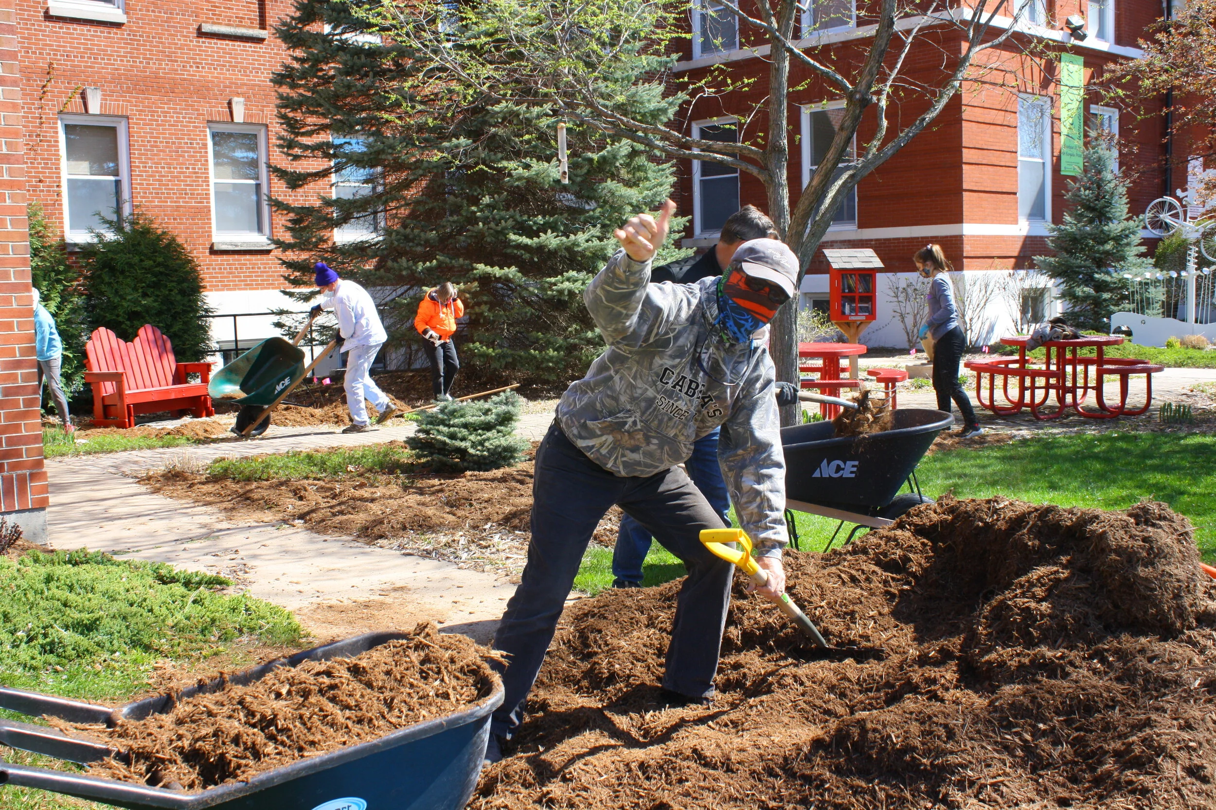 Phil Burkart at the Spring 2020 socially-distanced Town Square Board Mulching Party outside Town Square.
