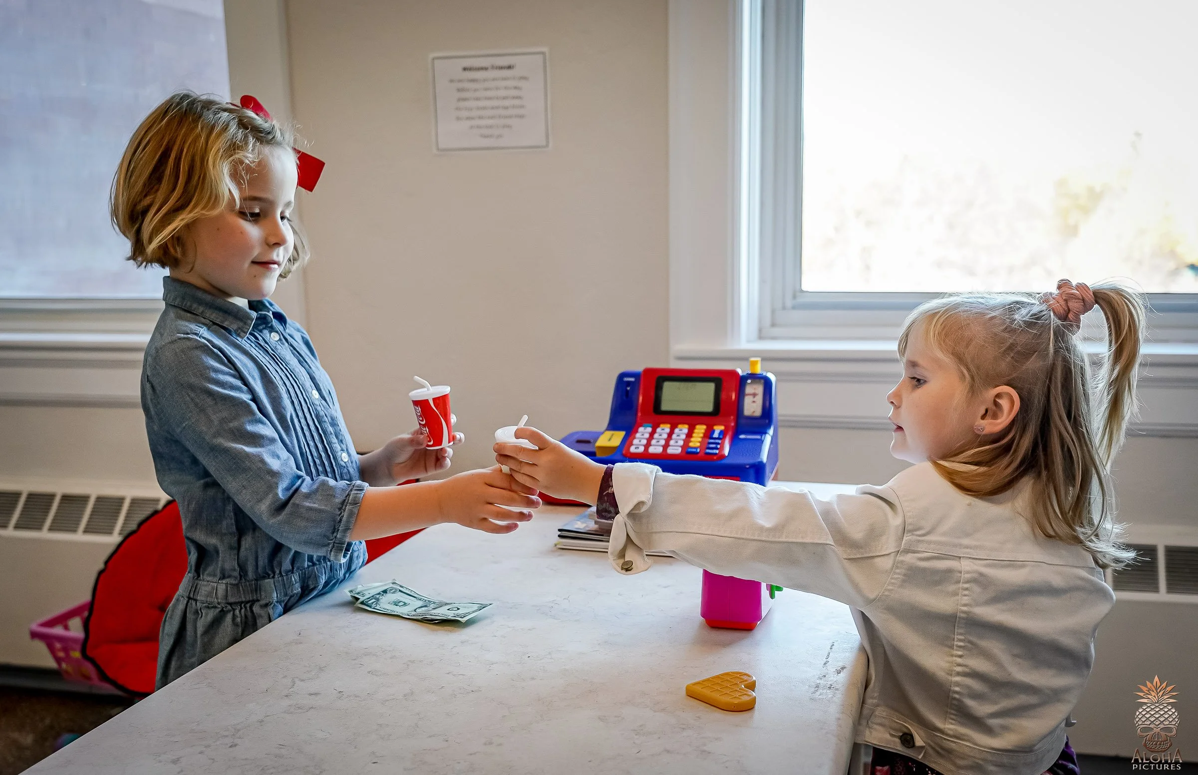 Children enjoying pretend play at the Imagination Station inside The Hub in Green Lake, Wisconsin.