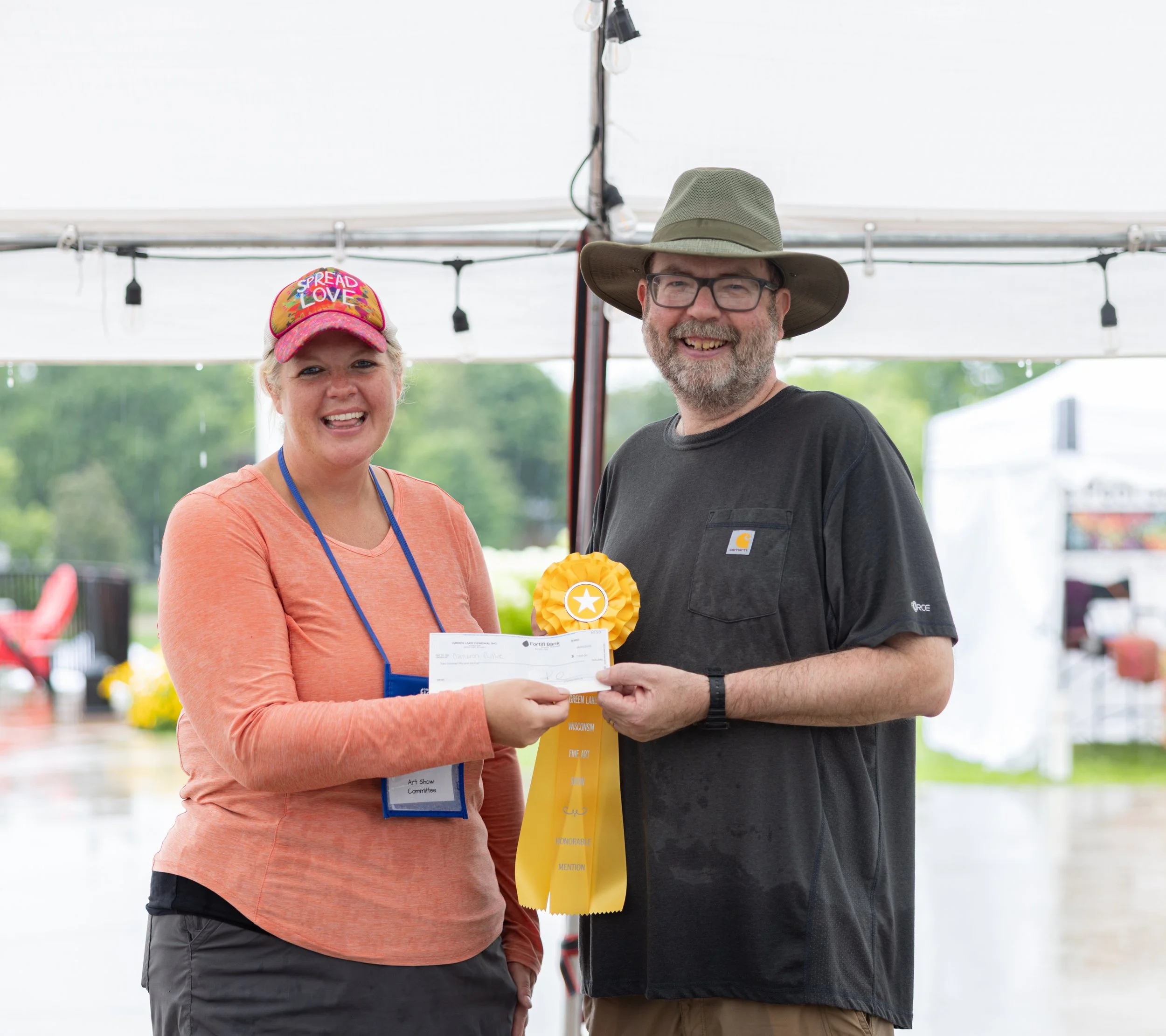 Jina handing artist prize ribbon and check.jpg