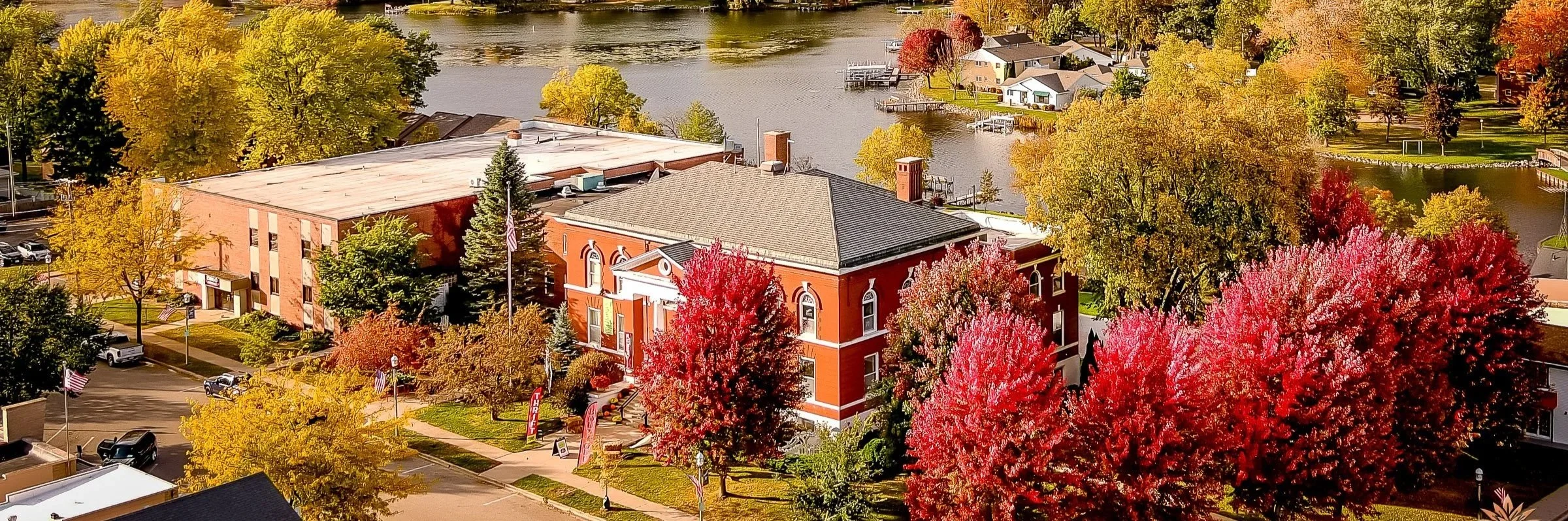 Exterior view of Town Square Community Center in Green Lake, Wisconsin, near the pond.