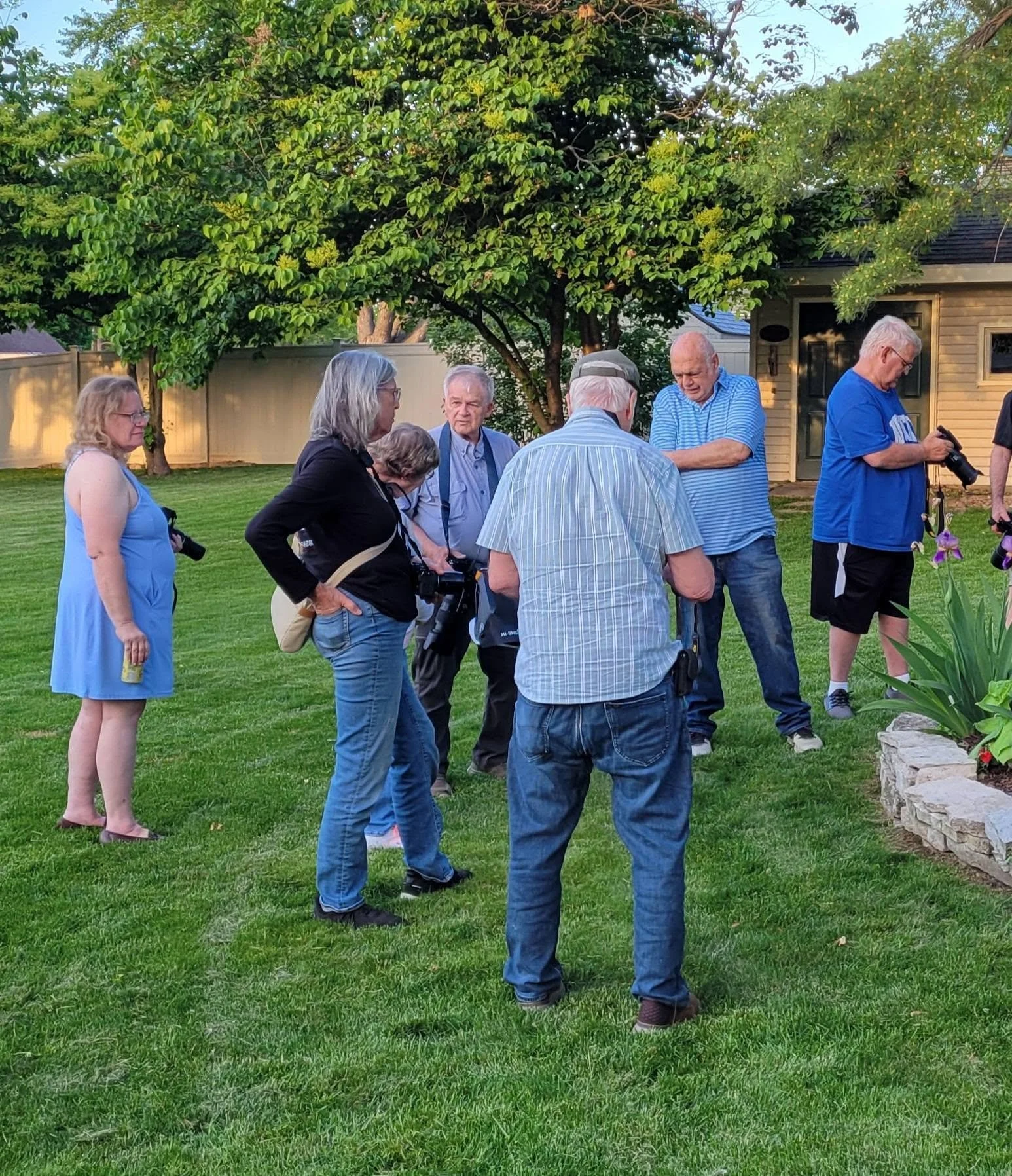Town Square Photography Group members gather outdoors with cameras during a group photography outing.