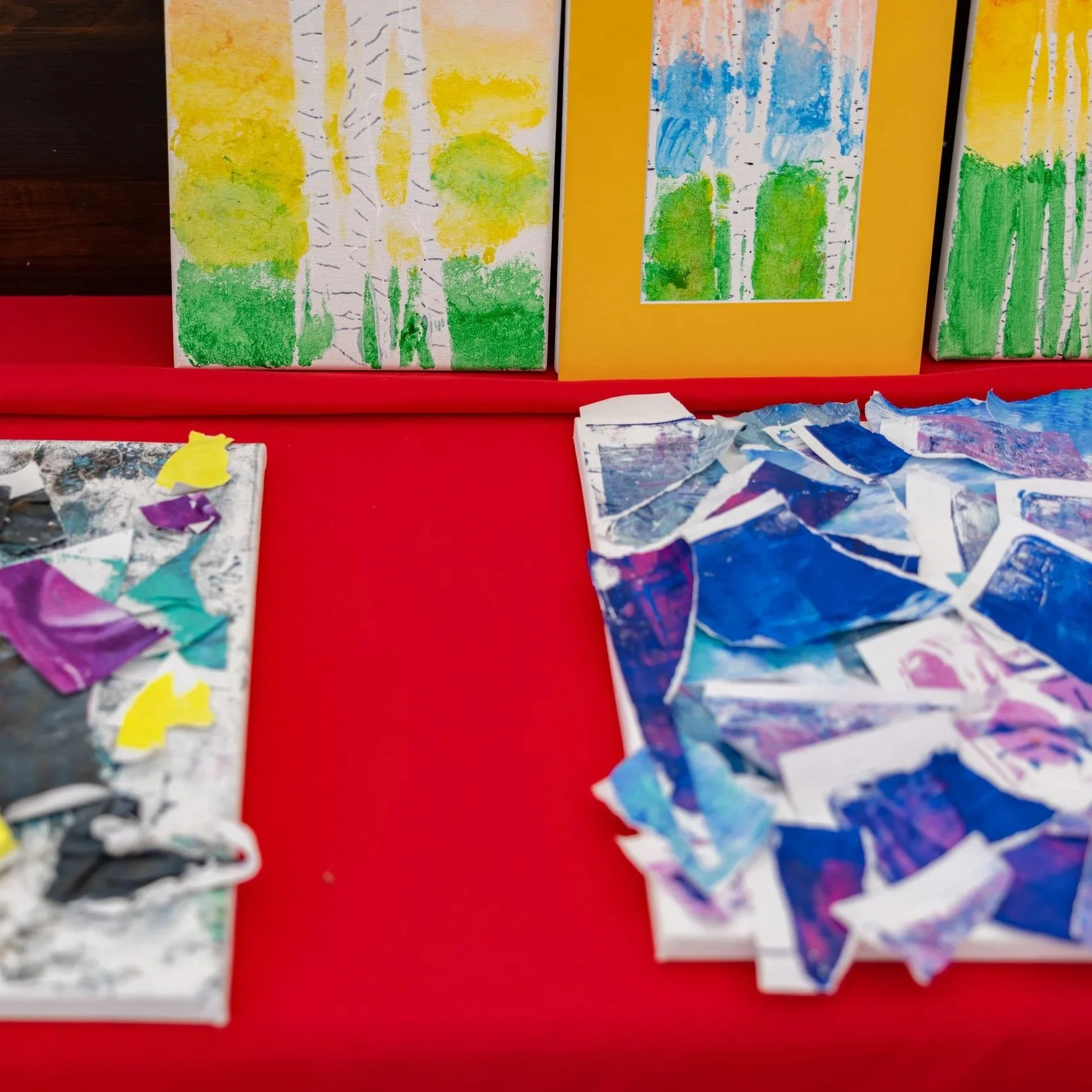 Colorful artwork created by young artists during Town Square Art Camp showcases painting projects, creative expression, youth art programs, and hands-on community art experiences in Green Lake.