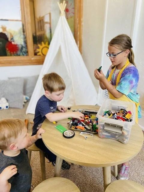 Kids playing together in The Hub, a free children’s play space at Town Square Community Center.