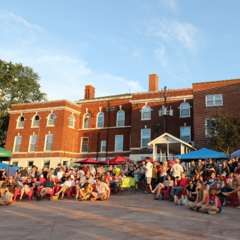 Large group of people gathered on the Mill Pond Terrace.