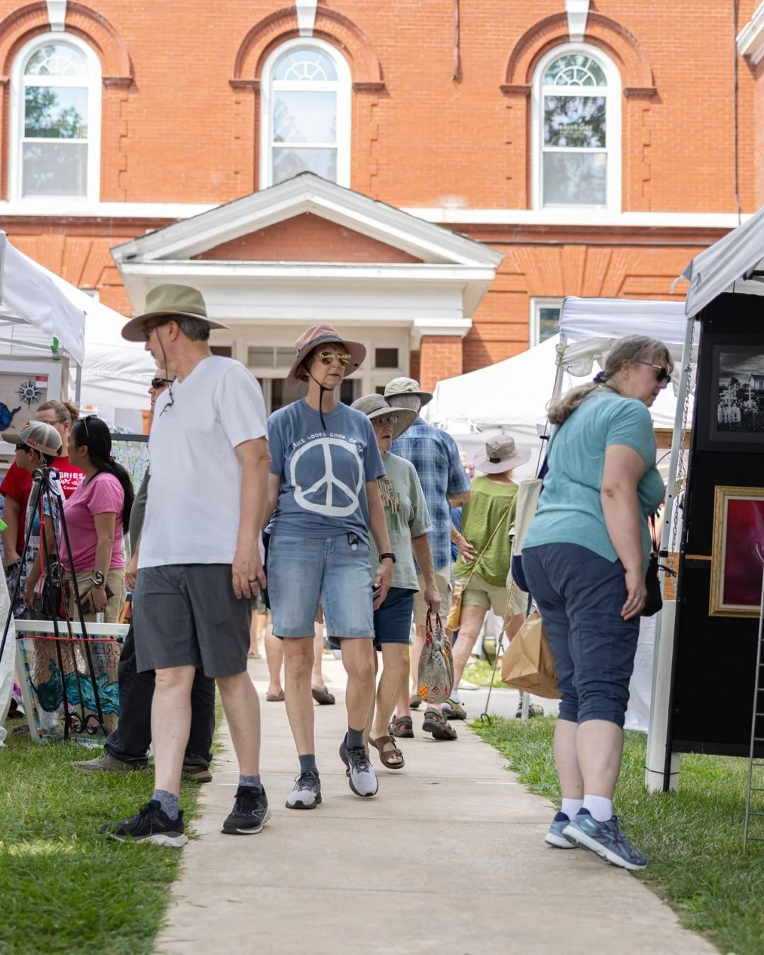 Visitors attending an art show at Town Square.