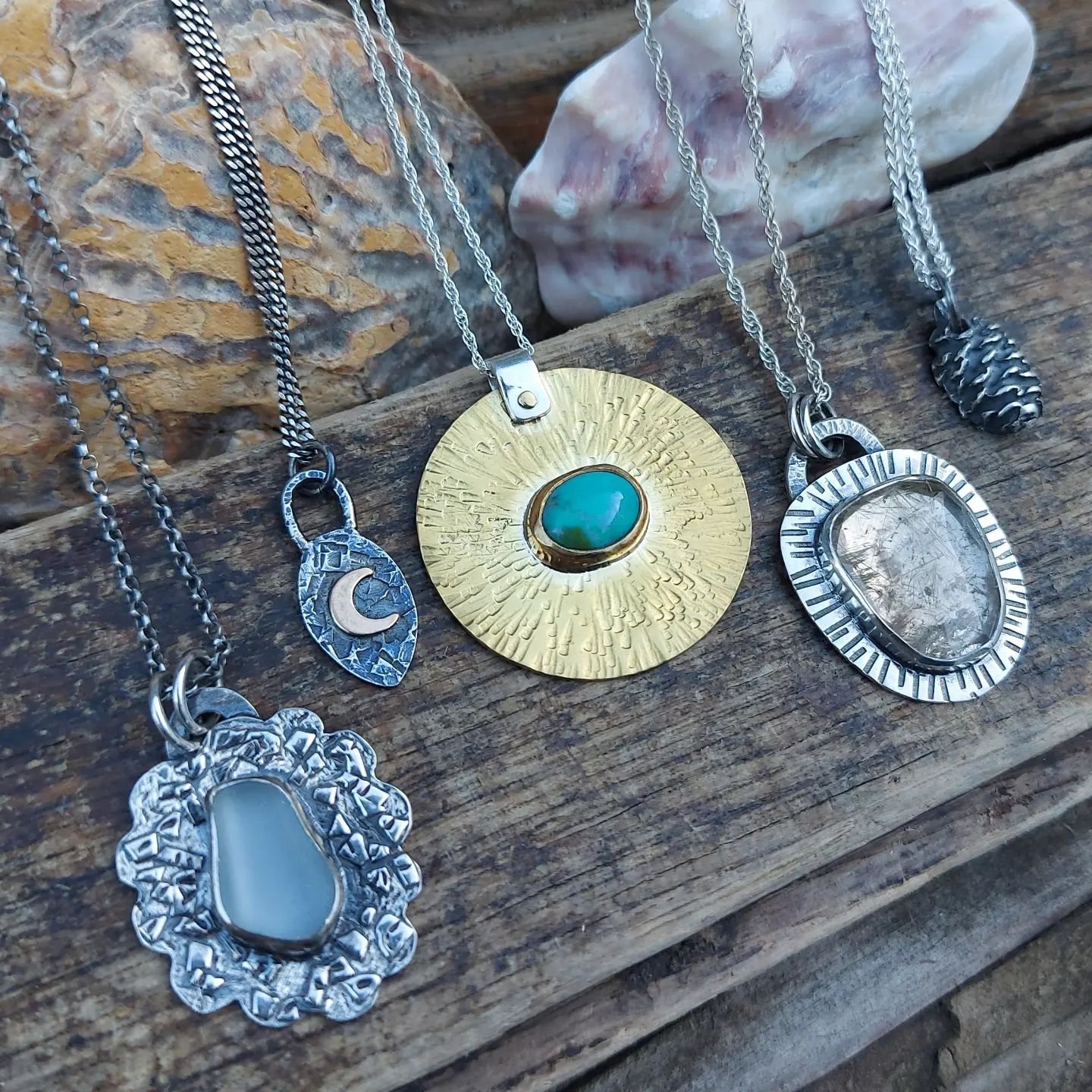 I've been having a sort through some photos tonight and doing some admin. I came across this beautiful shot of five pendants I took a little while ago and thought I'd share it. 

I love the mixture of styles, metals, and processes on display here - g
