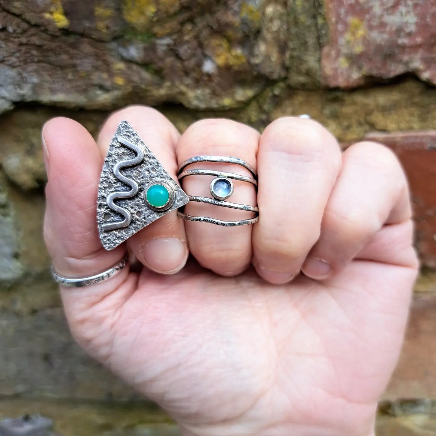 Chrysoprase is a beautiful green stone - it kind of has a milky or misty quality to it, so I went all out on texture to make it POP out of this triangular ring.  The other ring is a moonstone, nestled in strands of lightly hammered sterling silver. I