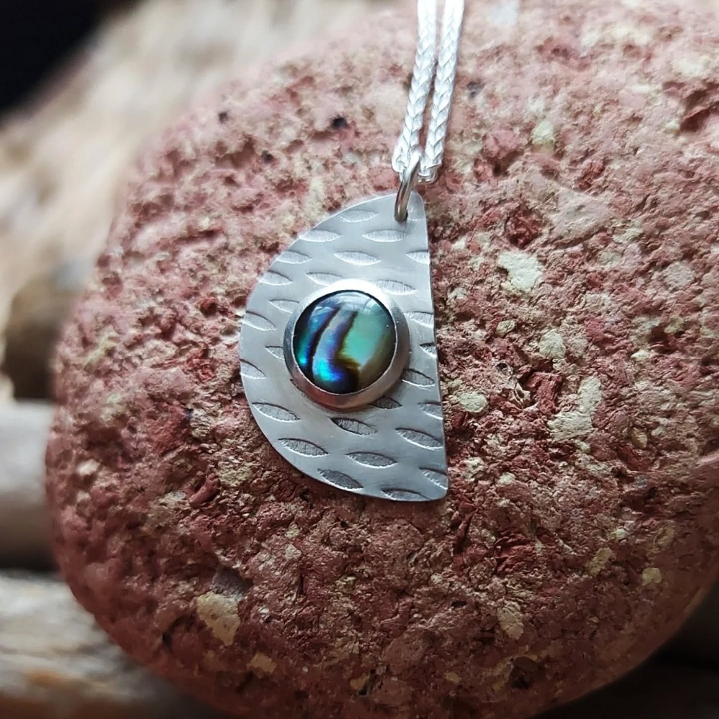 Moon-shaped paua shell pendant. These shimmery &quot;stones&quot; are the most beautiful to work with as they are always utterly unique and catch the light and shade depending on the weather and the lighting. This one is only one I have available as 