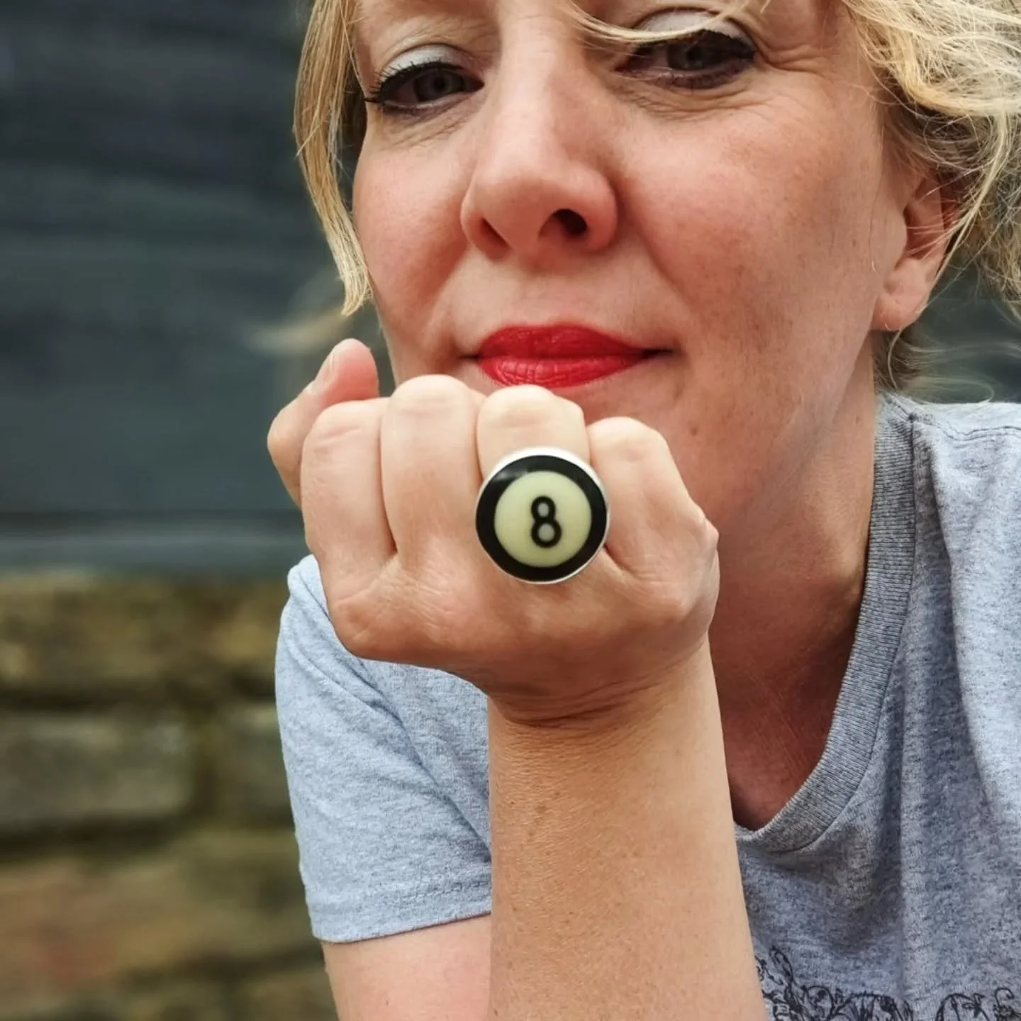 The beauty of making one-of-a-kind pieces is that you can pick up EXACTLY what you feel like (in this case a beautifully cut slice of a black 8 billiard ball) and make EXACTLY what you like (in this case a chunky silver ring).

This is one of the mos