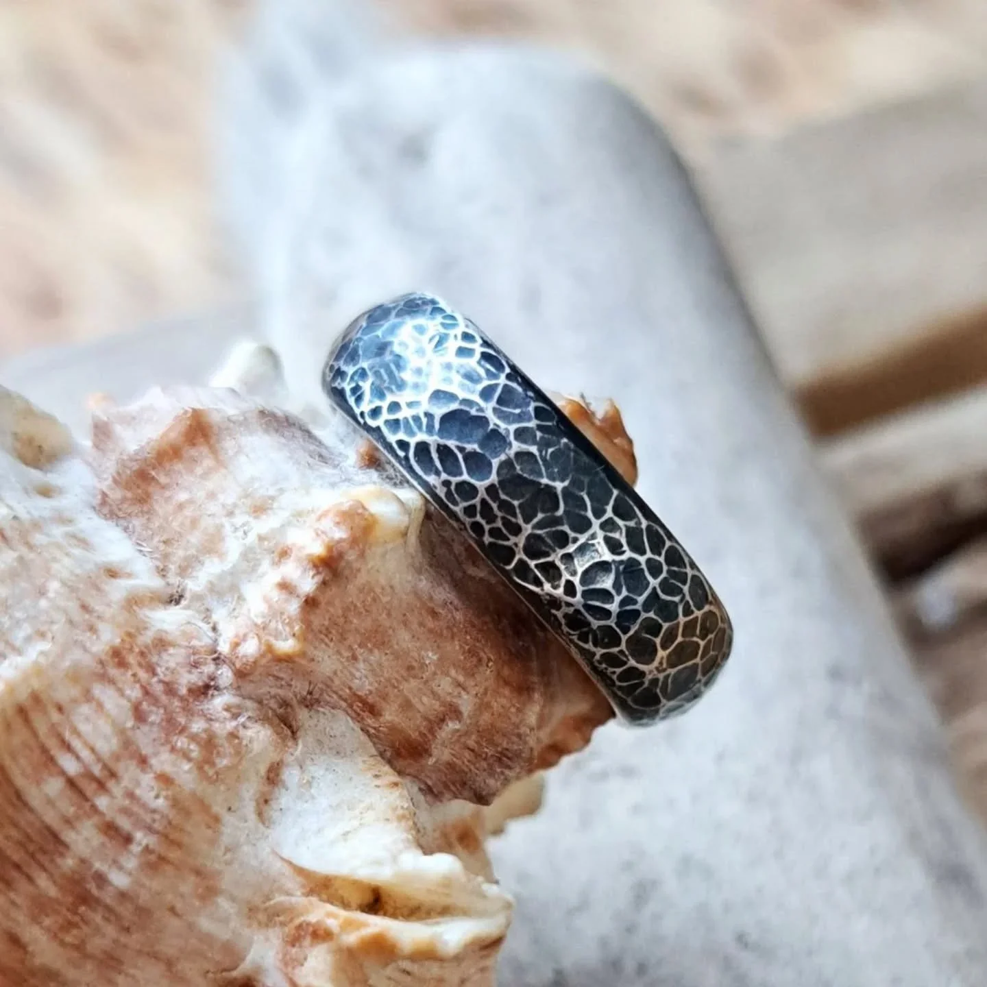 Beautiful crackled silver ring on a very comfortable D shaped band. The silver has been hammered slightly all over and then oxidised and polished to create this finish. Sometimes, simple is best 👌 

https://www.ilovedollyjewellery.co.uk/rings/solid-