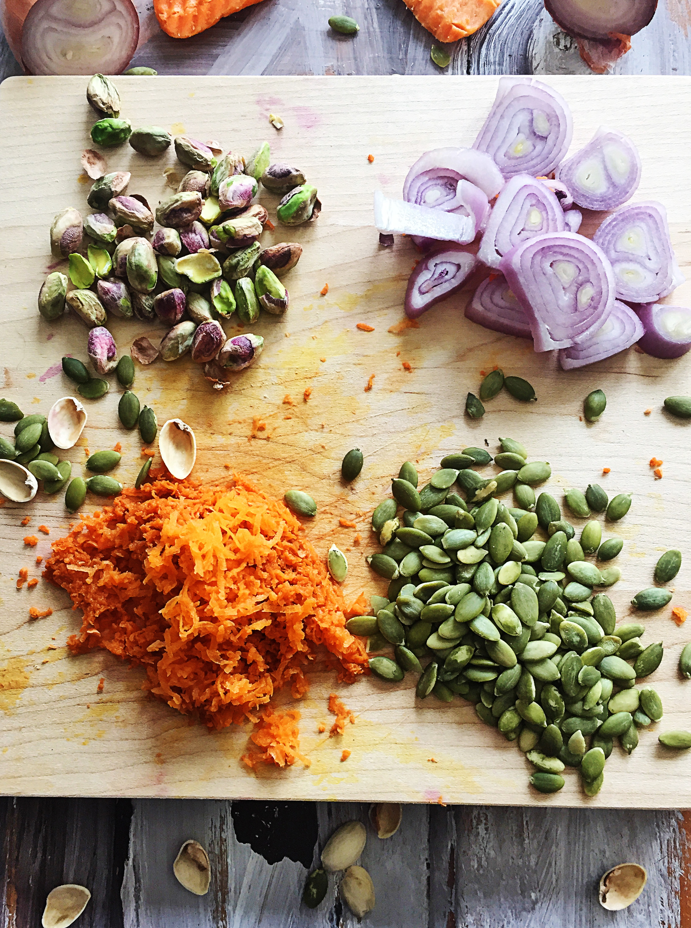 2. Grate carrots and measure out pistachios + pumpkin seeds. Roughly chop shallot. Get all ingredients from flaxseed egg through black pepper prepared and place into food processor.