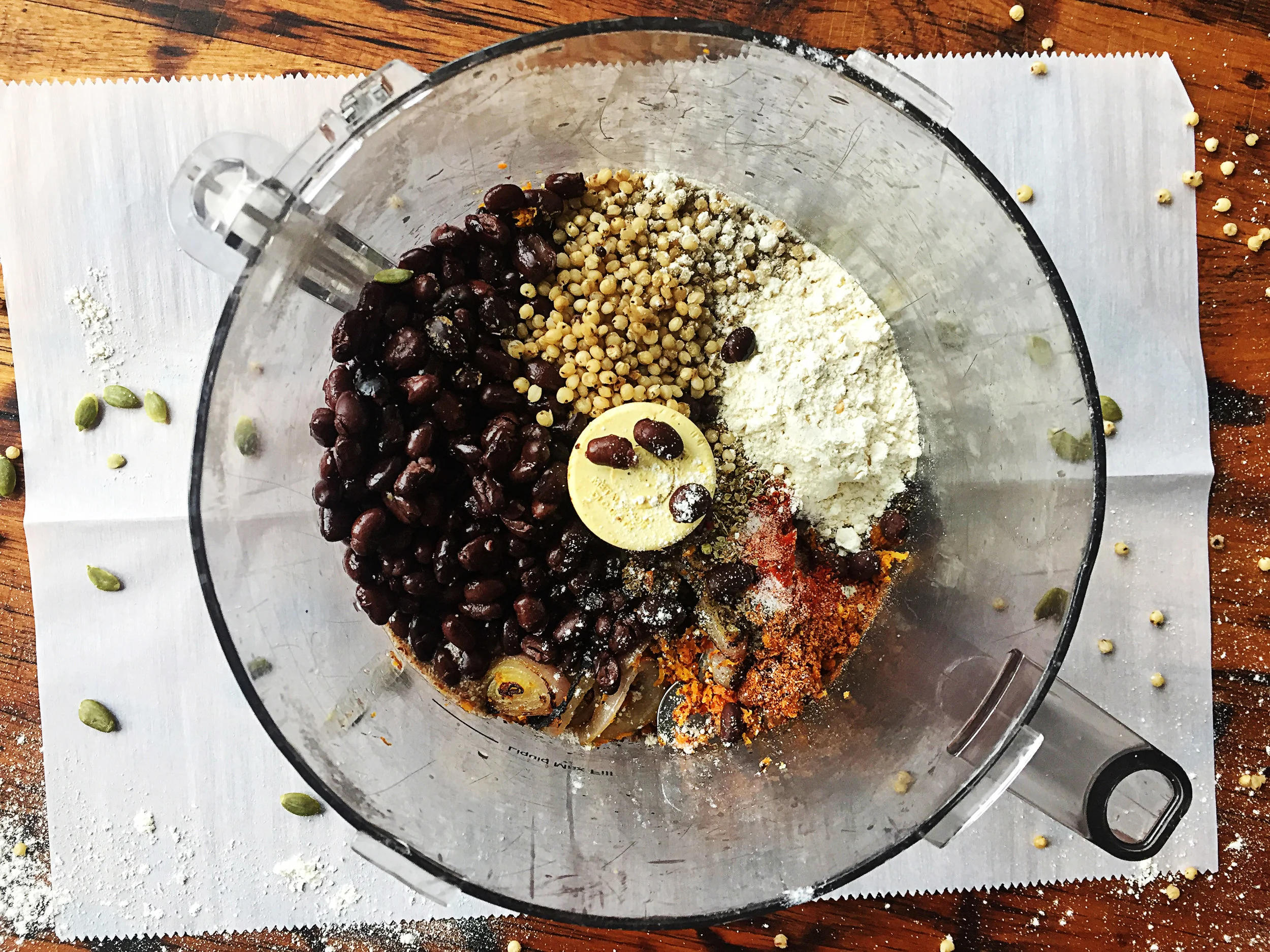 4. While the onions are cooking, place all ingredients for burgers into a food processor and mix for up to 60 seconds. The mixture will firm up and ball up and not mix any longer. Mix and chop for 10 seconds.