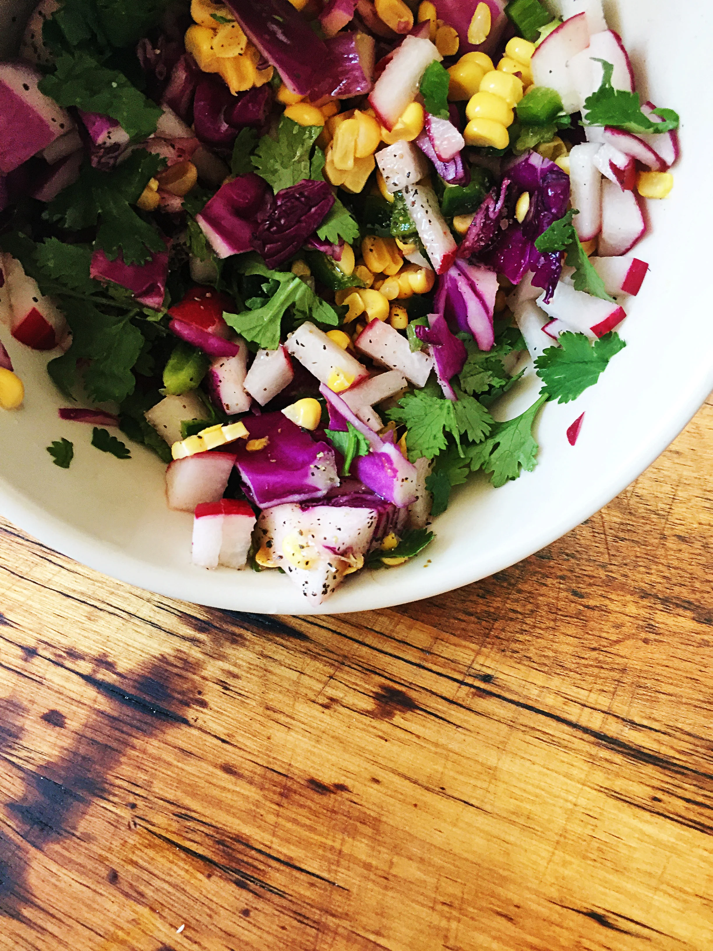 5. Next, let's make a quick slaw. Mix together all the slaw ingredients in a small serving bowl. Salt + pepper to taste.