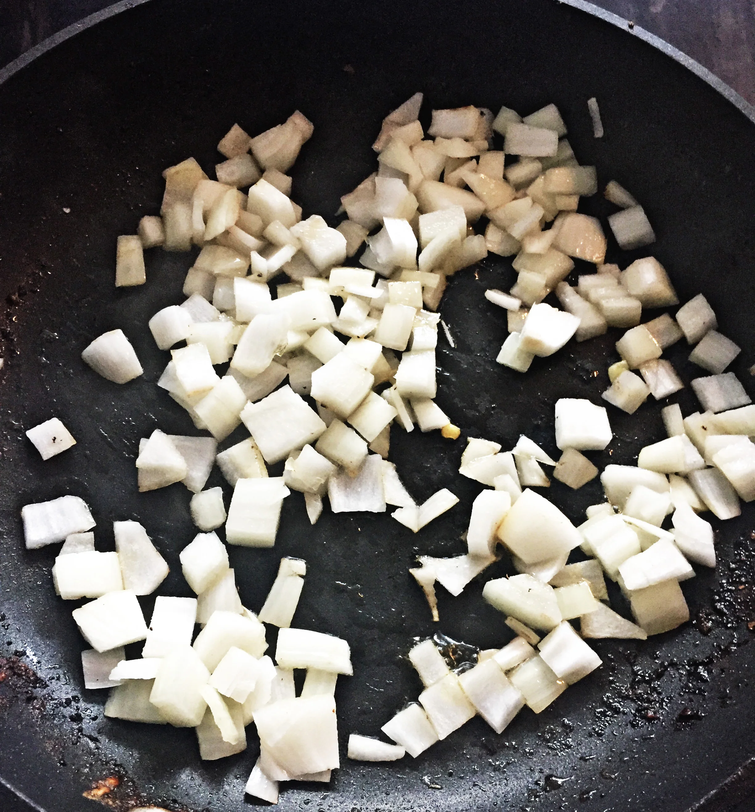 5. In a medium frying pan, add oil and heat over medium heat. Add diced onions and cook for 5 minutes.