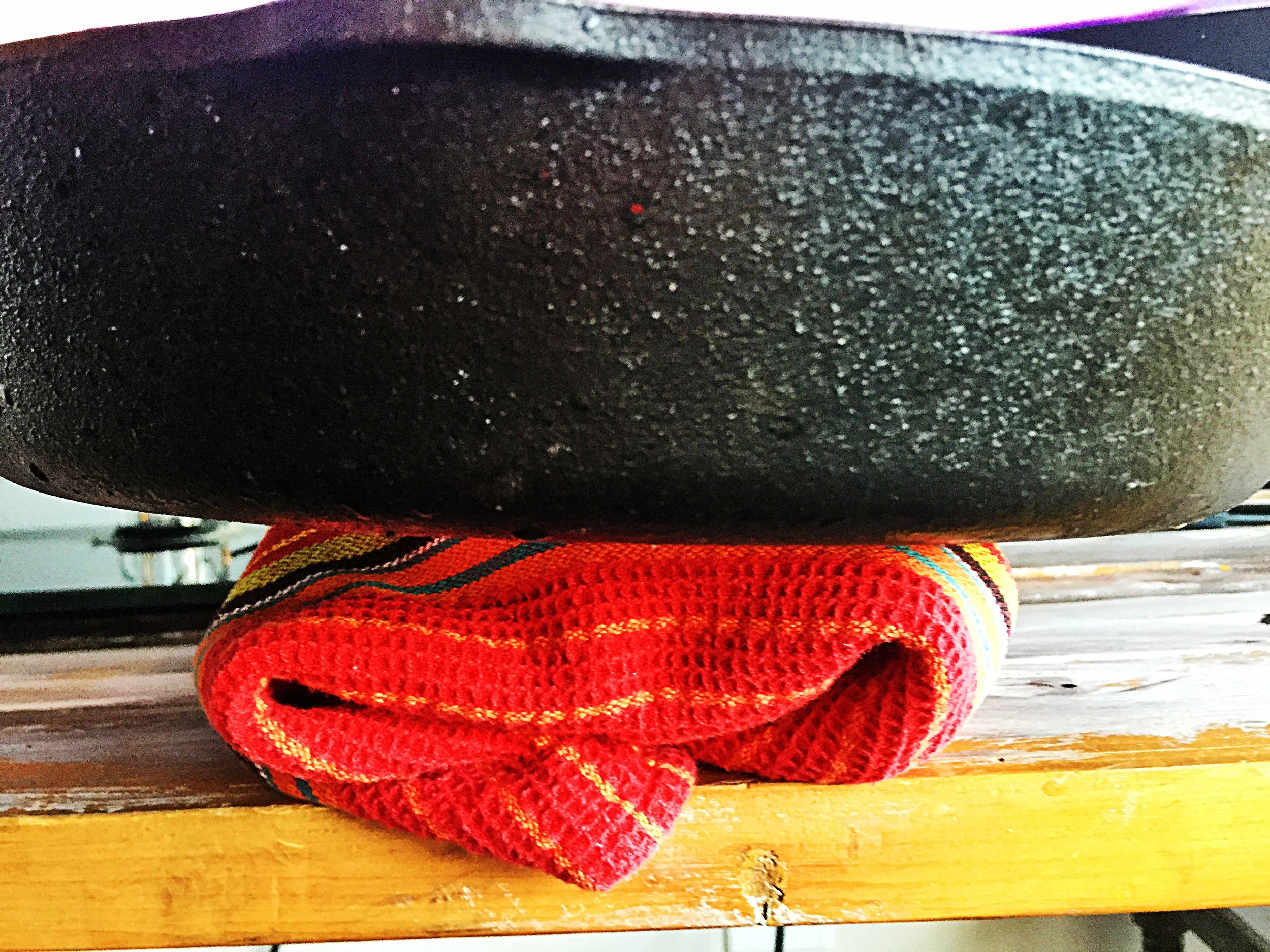 1. Start by opening tof, wrapping in a clean dish towel, and place a heavy pan on top of it like a castiron pan. If you do not have a castiron pan, some heavy books or pan with books on top of it. 