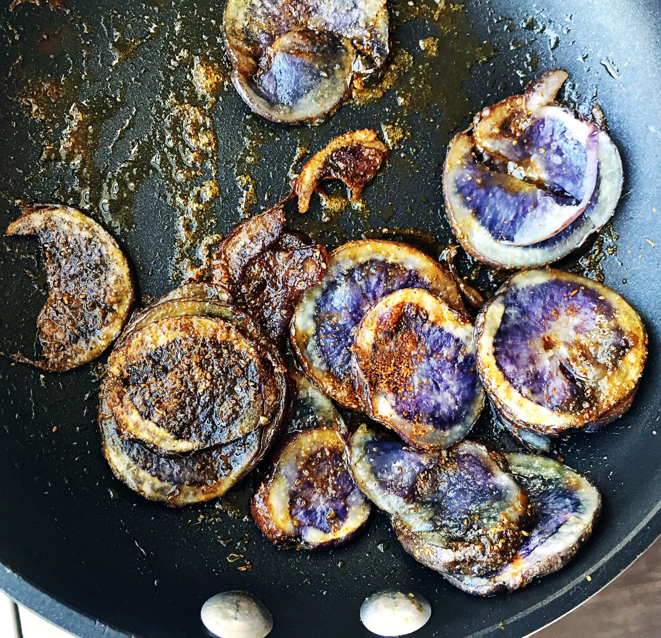 5. Next, add the thinly sliced potato to the microwave and cook for 3-4 minutes. Then add to a small frying pan with oil and spices. Cook for 5-10 minutes until starts to brown. Set aside.