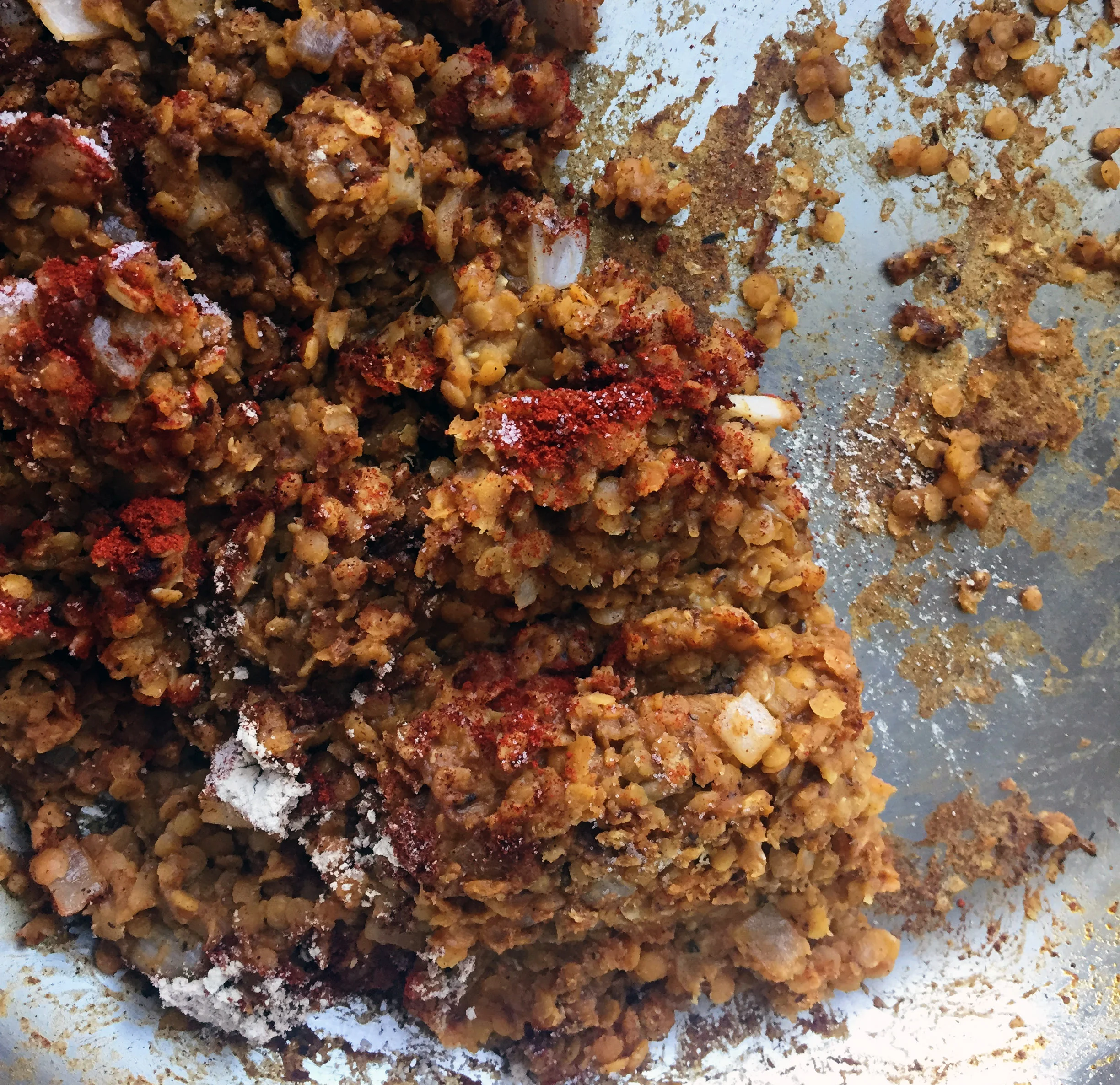 5. Add lentils to the pan and continue to cook for another few minutes over medium heat.