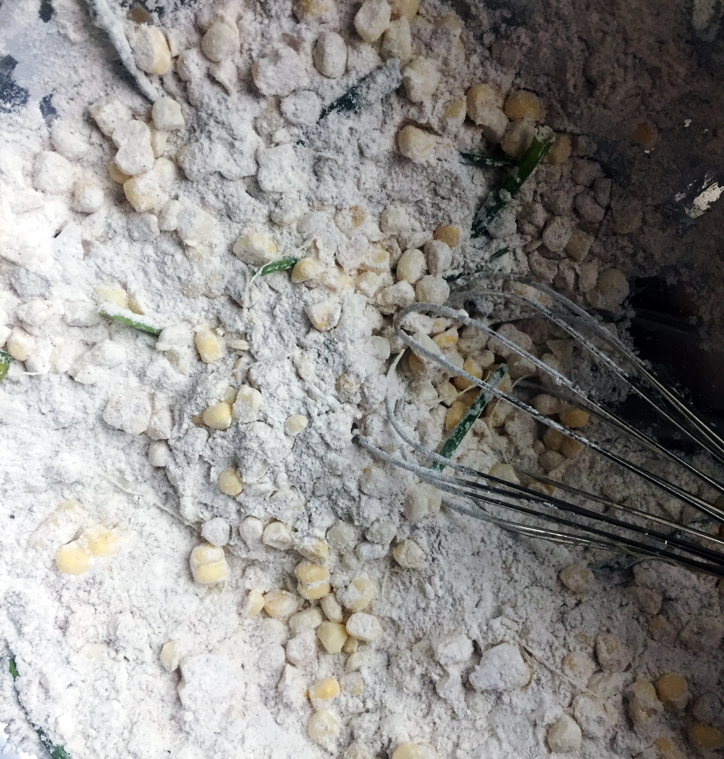 2. Add in your corn kernels and chives. Mix well to coat the fresh veggies.