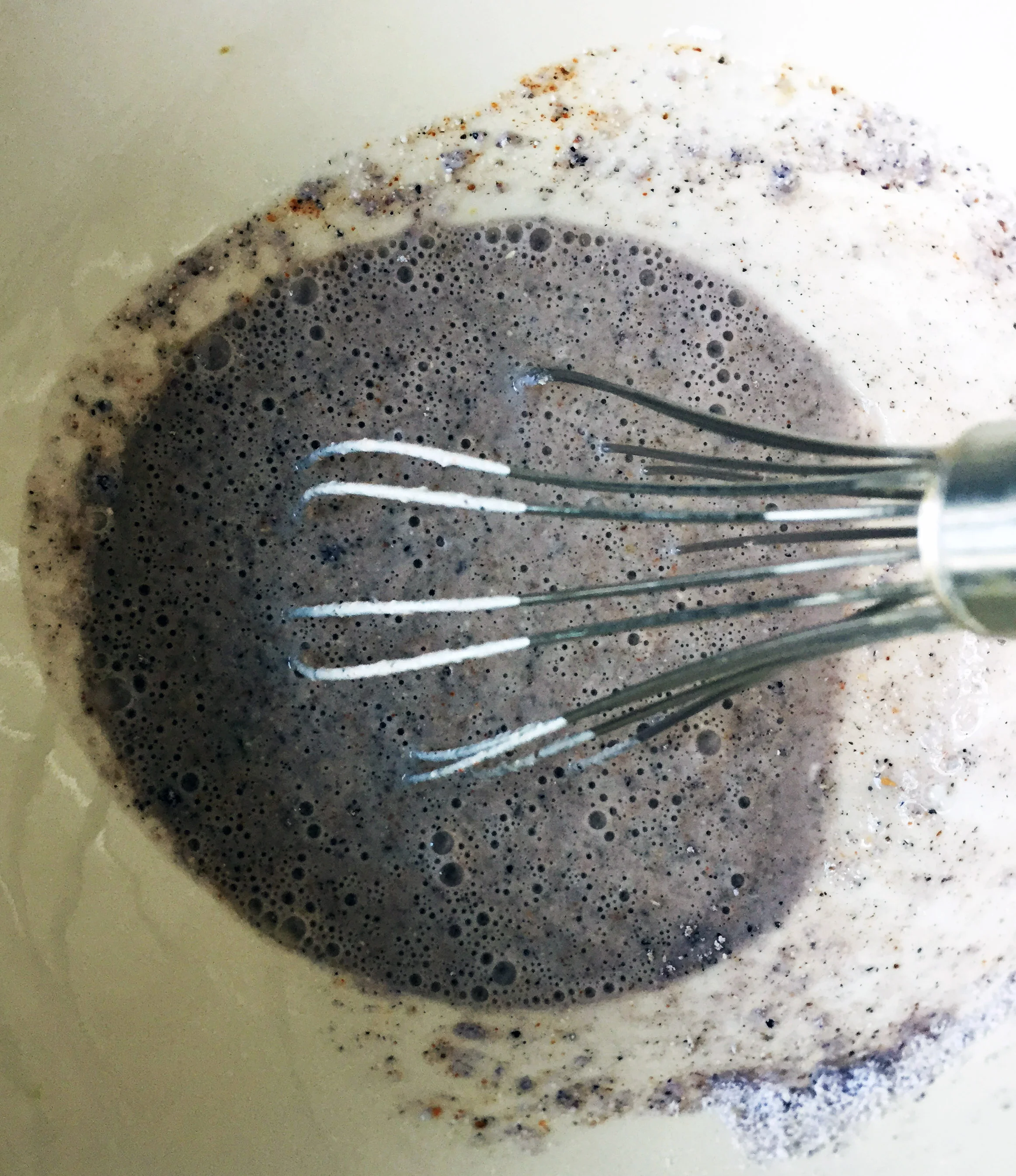 2. Whisk together the flour, cornmeal, milk, and spices. Everything sans bread crumbs.