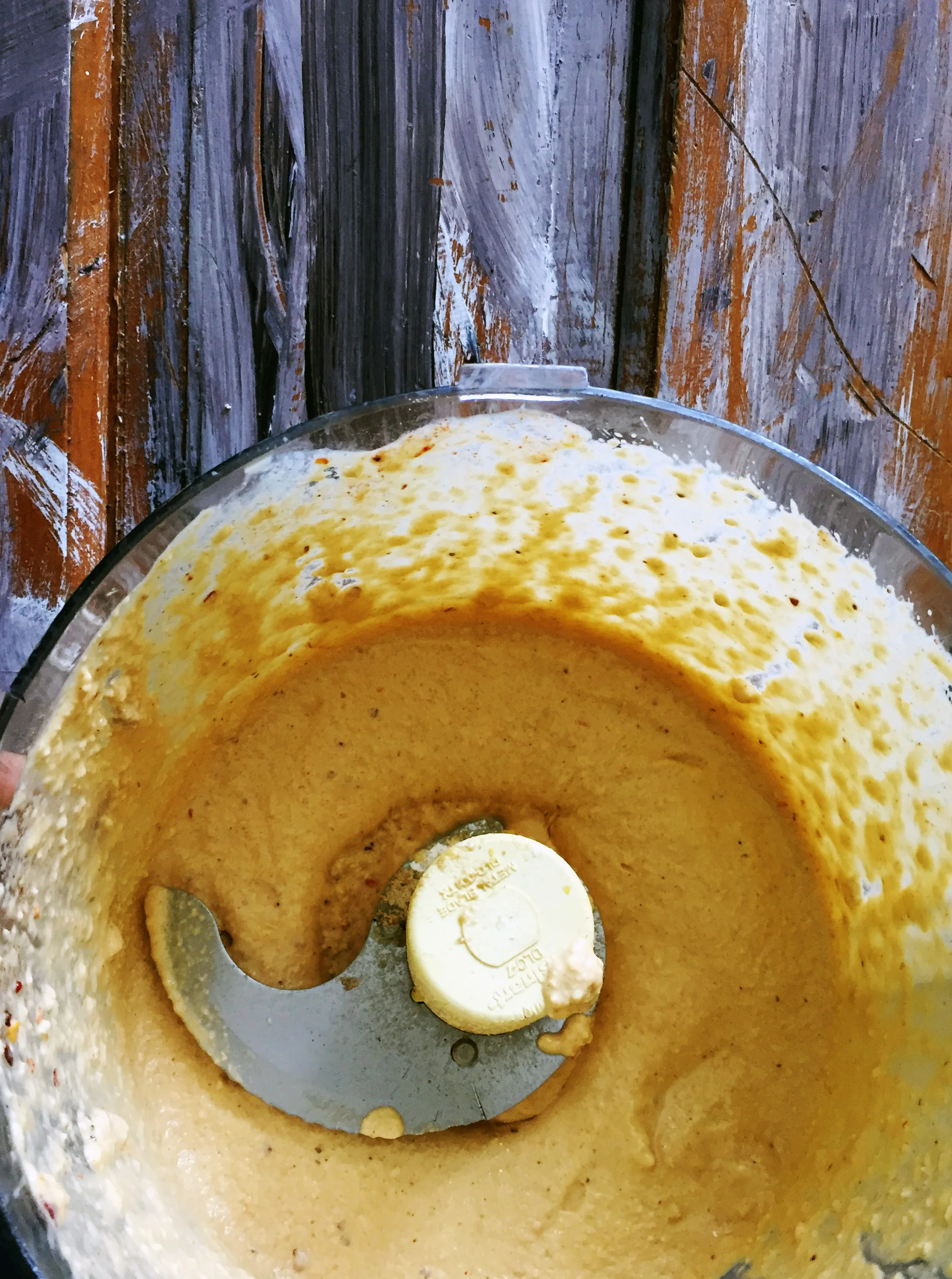 2. After cashews have soaked, place all ingredients for cheese sauce into processor and turn on for 45-60 seconds until a smooth paste has formed.