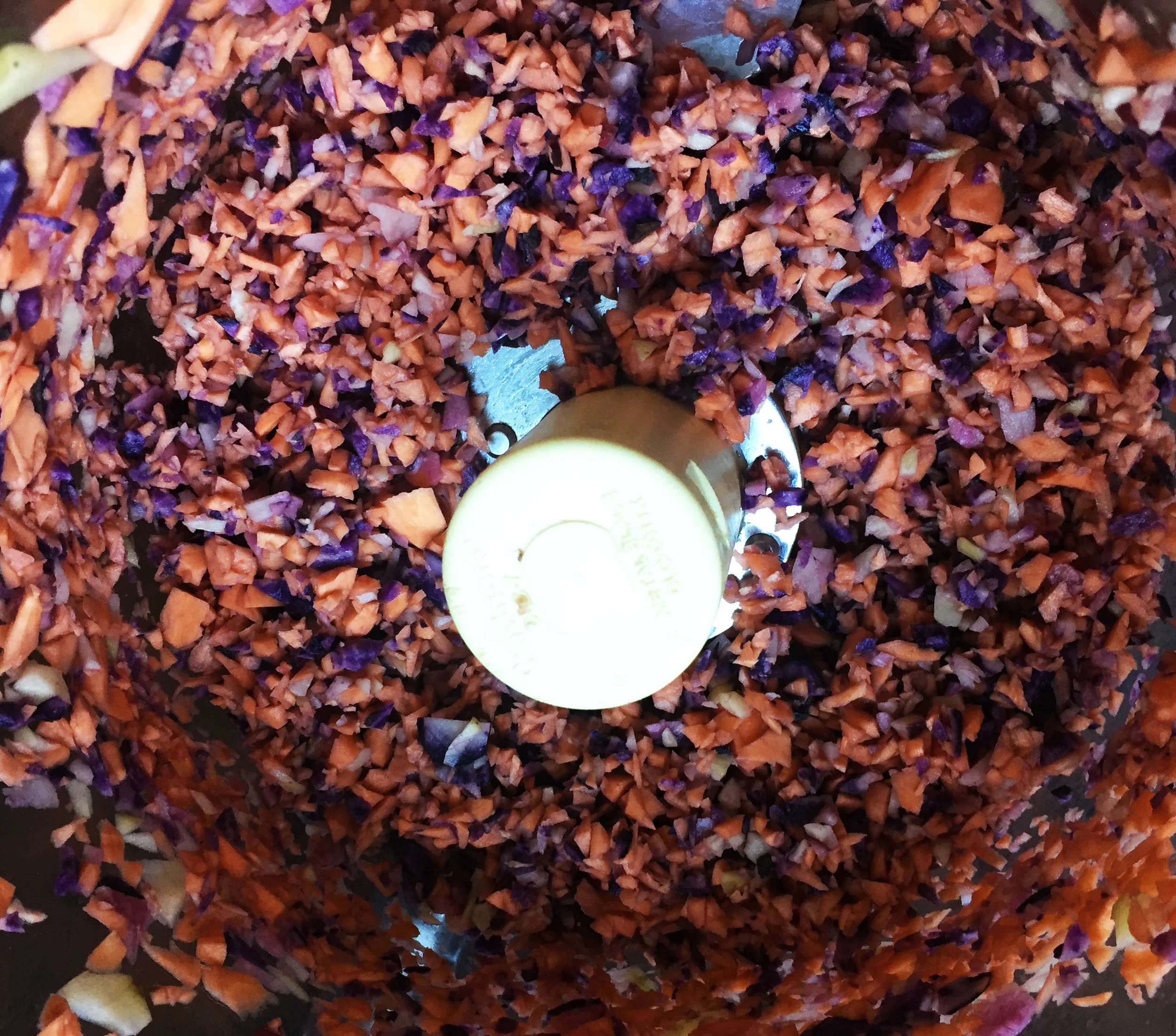 1. To start, place your potato cubes into the food processor or blend and pulse until you have small shreds. Place into mixing bowl. 