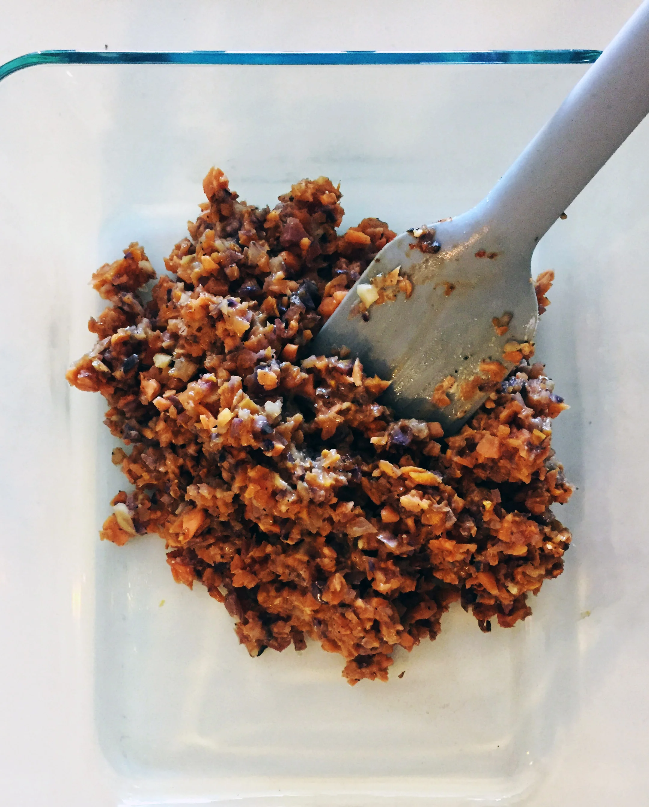 2. Place potatoes into frying pan over medium heat with spices and oil. Cook for 4-5 minutes. Take off pan and spread into bottom of casserole. Set aside.