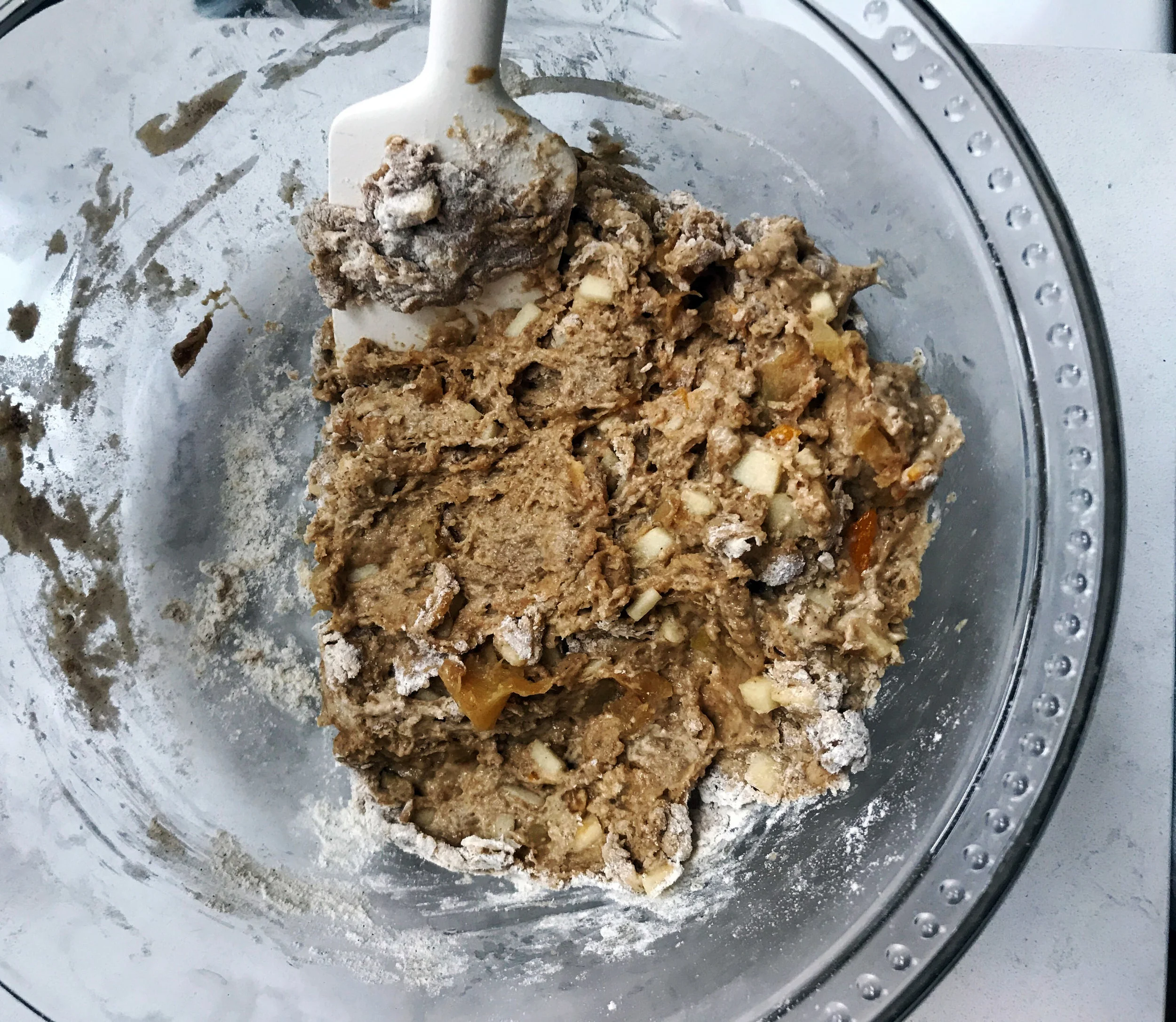 3. Slowly mix in the flax eggs, coconut sugar, dairy-free milk mixture, quick applesauce, and processed apples. Mix until well combined. The dough should feel dense and be one large mound...not smooth like muffin mix.