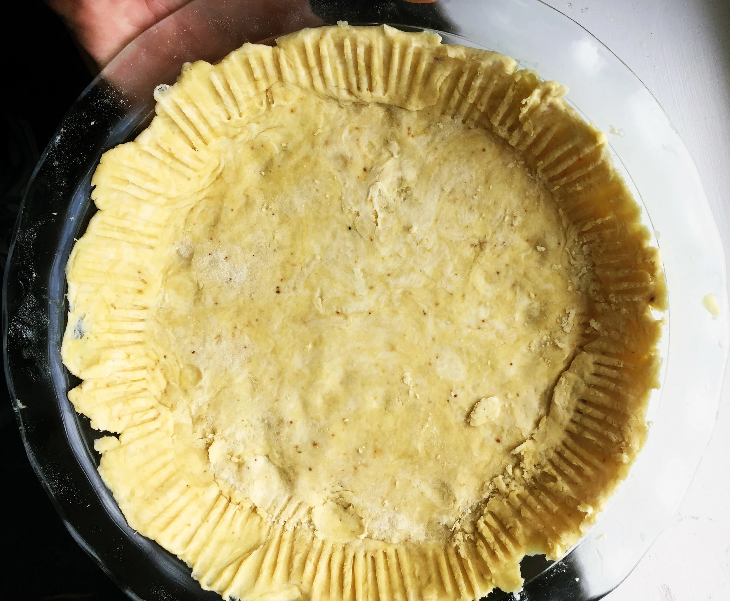 5. Take a fork and press the dough against the edges of the pan. 