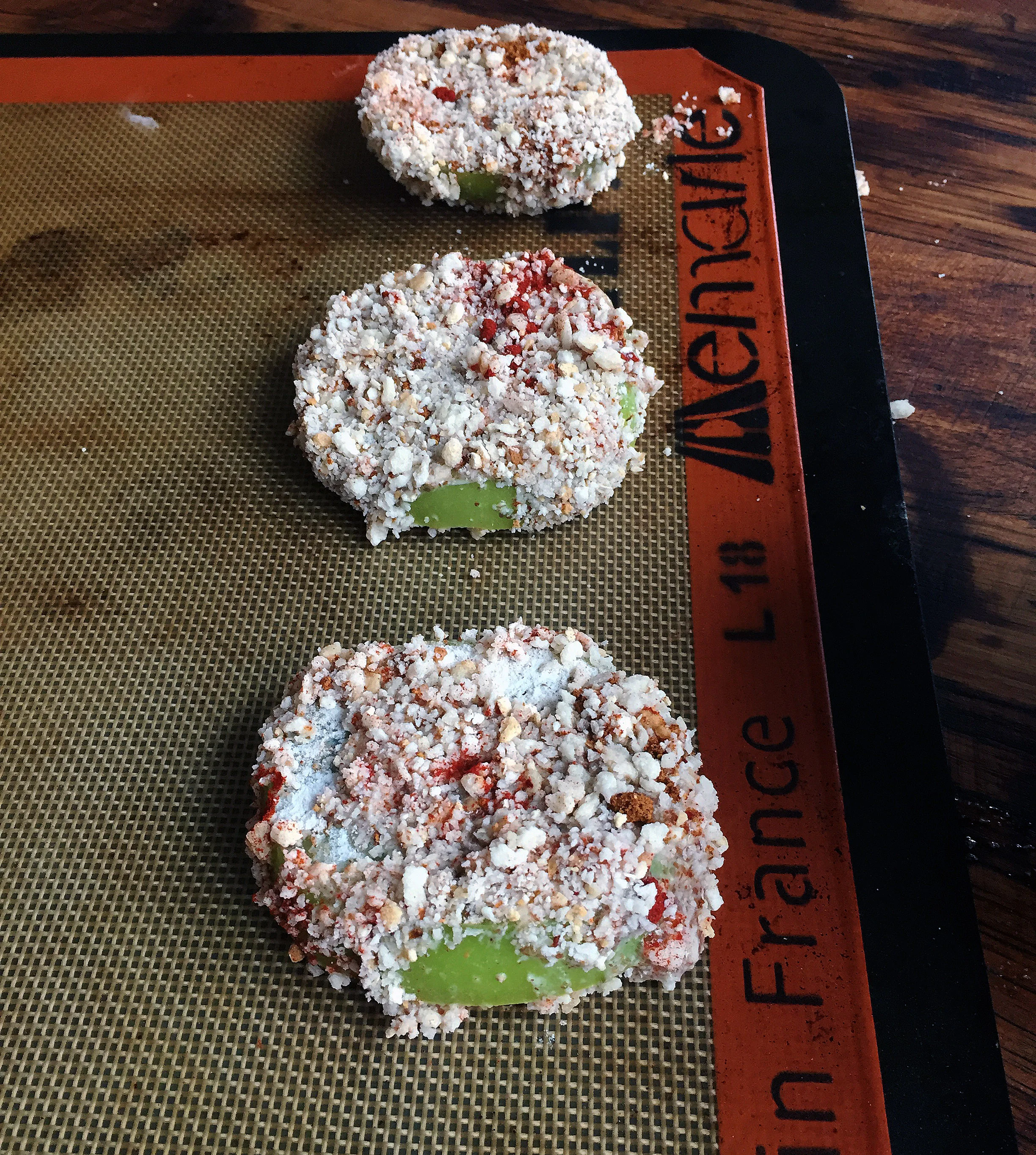 8. Line the tomatoes on a pan with a silpat or parchment paper on it. Put into oven and bake 15 minutes, flip tomatoes and bake another 10 minutes.