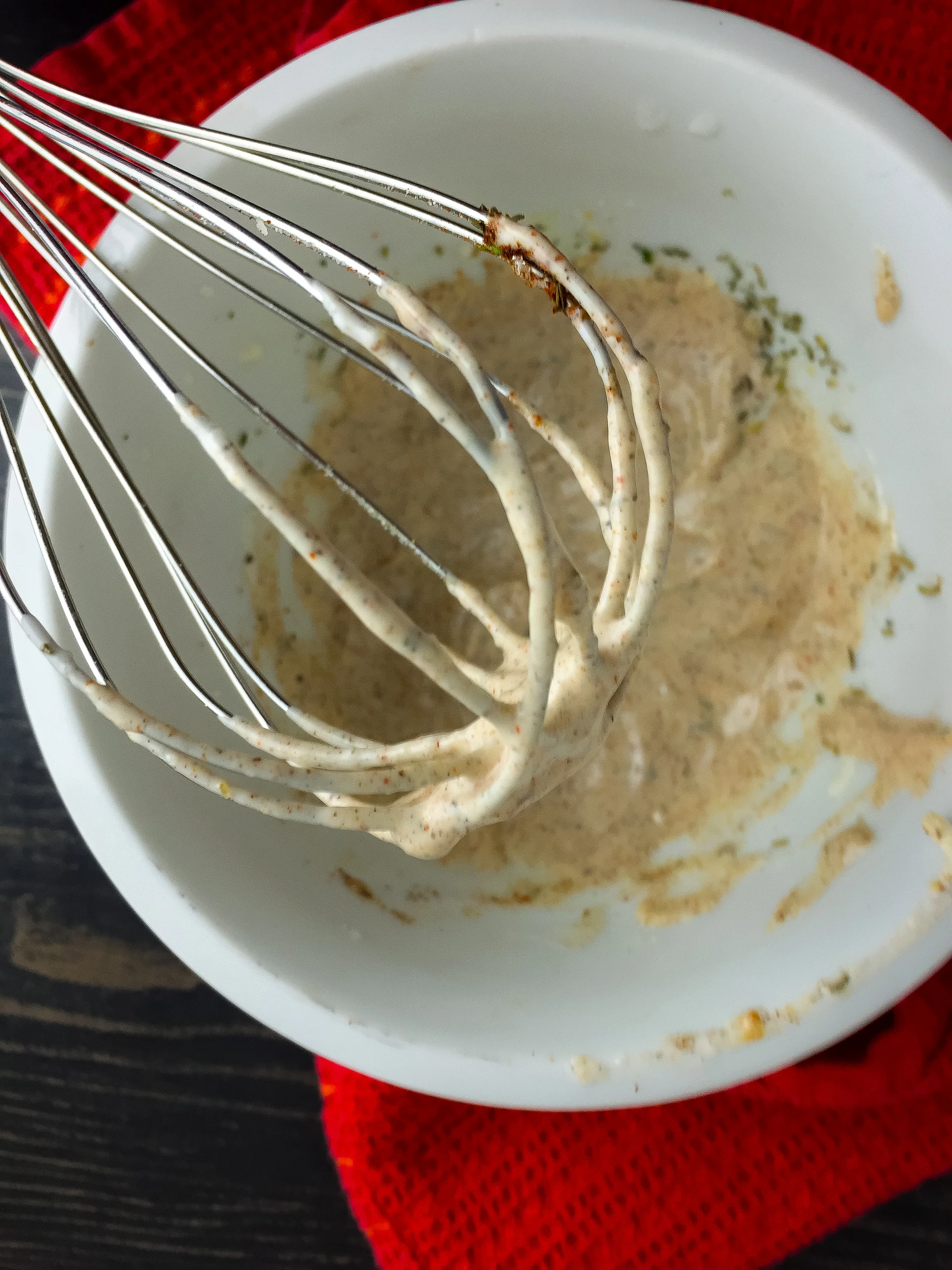 5. Whisk together all the aioli ingredients. Place into a plastic bag and snip off a corner to allow you to pipe it on the potatoes.