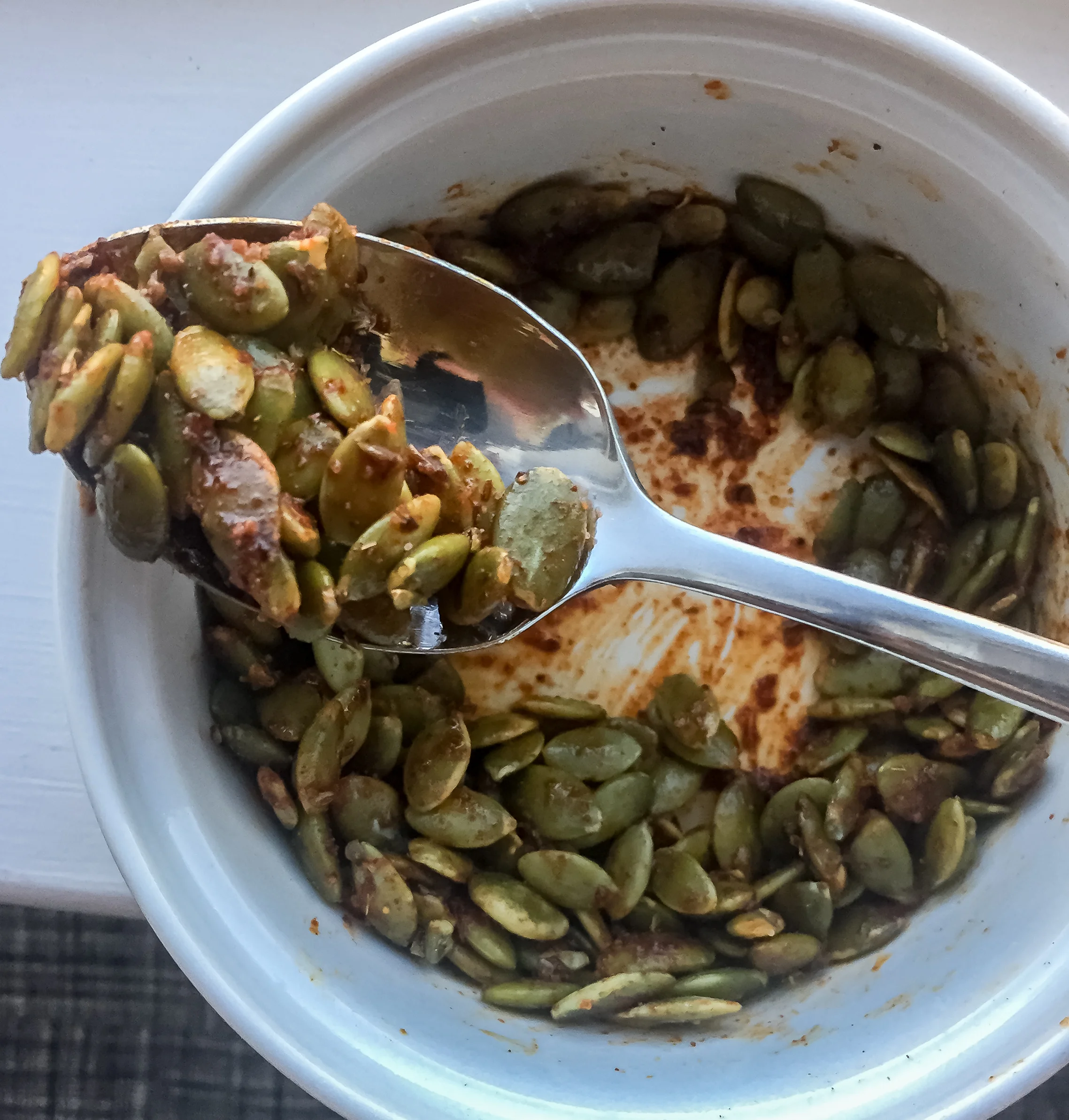 2. While that starts to cook or right before serving, heat the oil for the pepitas in a small pan for 60 seconds on medium heat. Throw in pepitas and spices. Cook for 3-4 minutes until nice and toasted.
