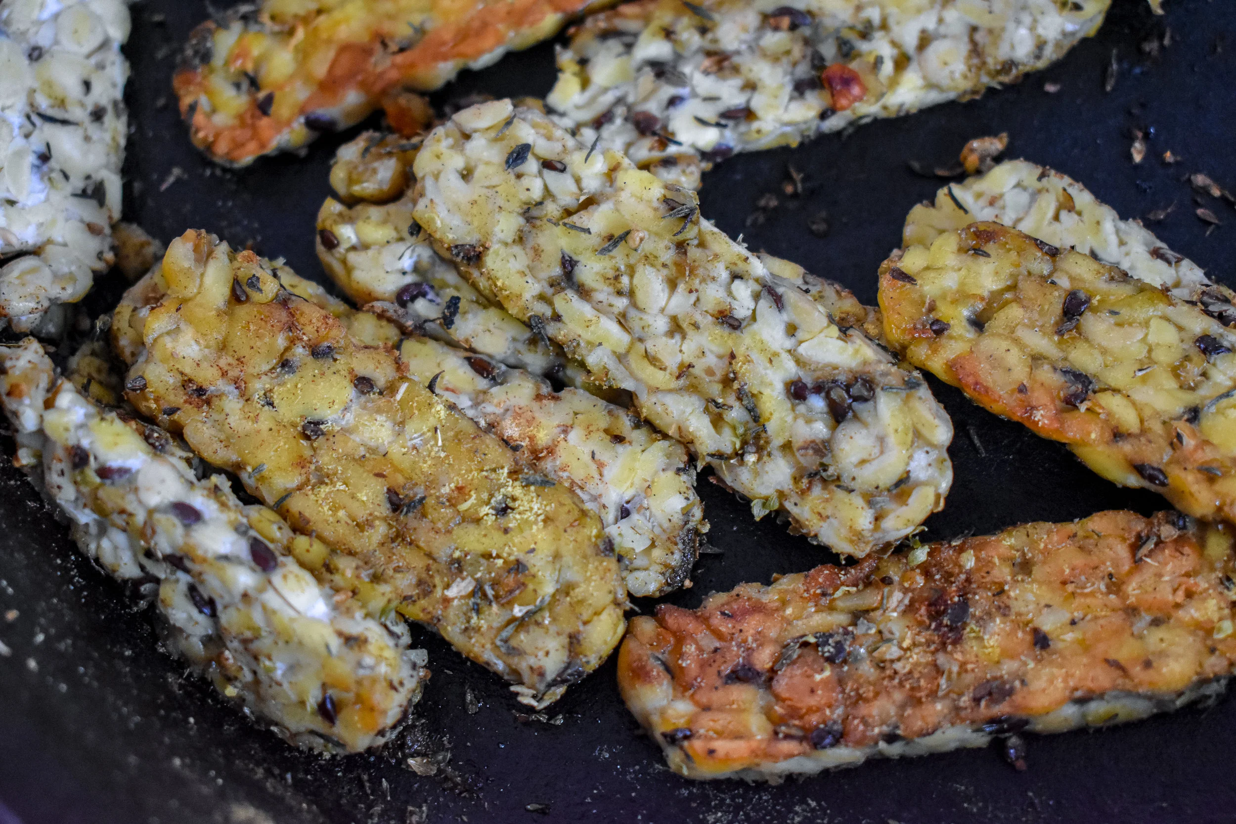 6. Place tempeh in a castiron pan with olive oil. Heat over medium heat for 3-4 minutes then add in remaining ingredients continue to heat until browns on sides.